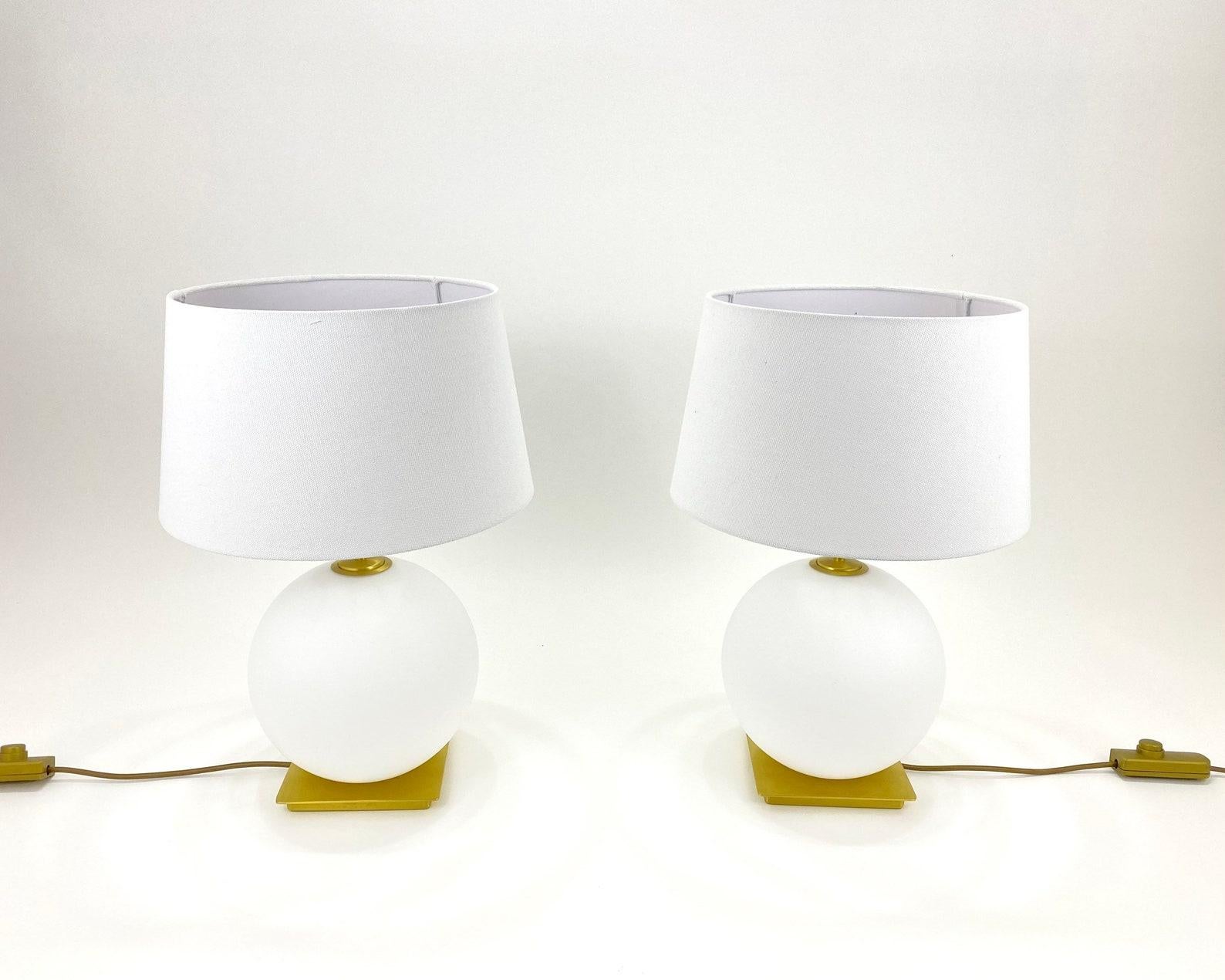 A pair of hiqh-quality designer table lamps from the famous company Holtkötter, Germany.

Holtkoetter has been engineering and manufacturing product in Germany for over 50 years and assembling product in the U.S. for about 30 years. 

Table