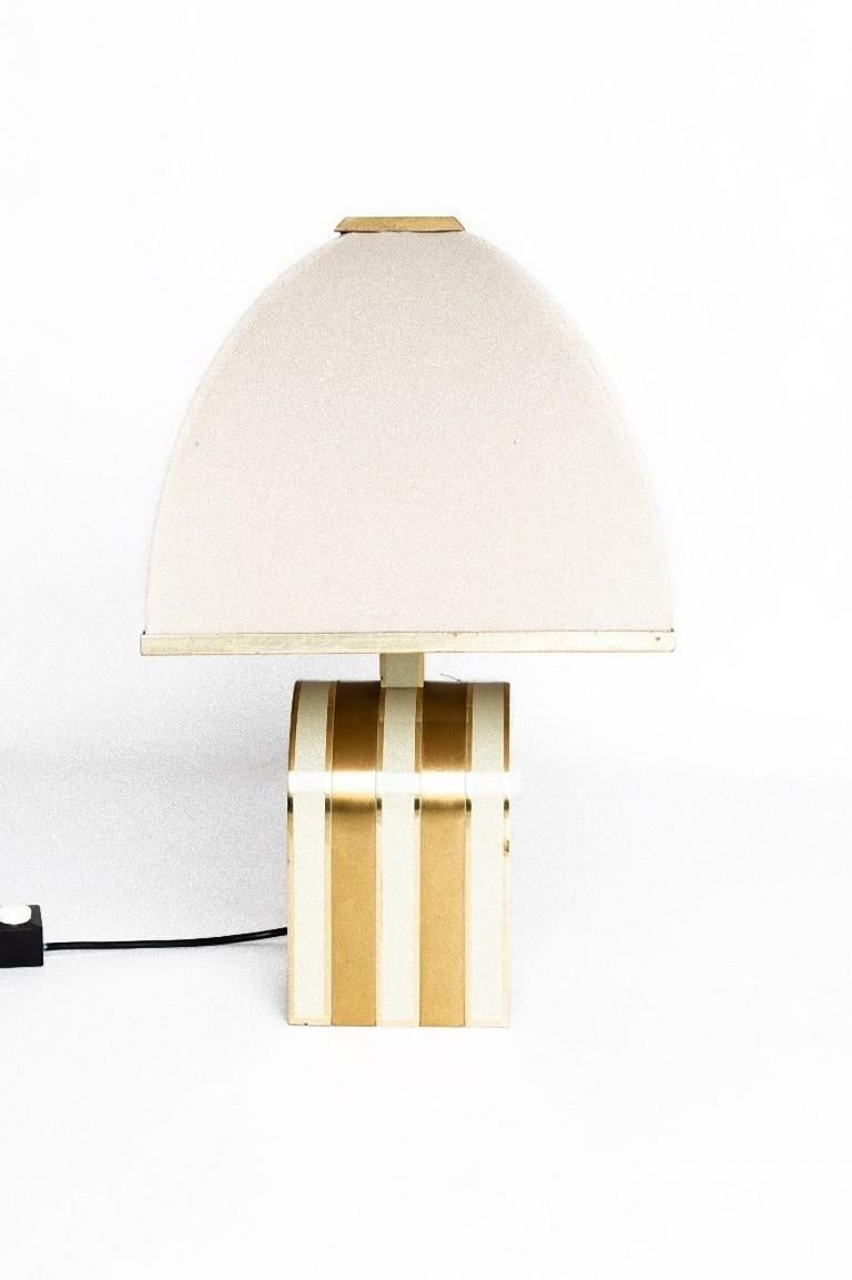 This vintage pair of table lamp is an original decorative object realized by Romeo Rega during the 1970s.

Exceptional design, this couple of table lamps is made in lacquer and brass. 

Dimensions: cm 45 x 15 x 15.

In very good