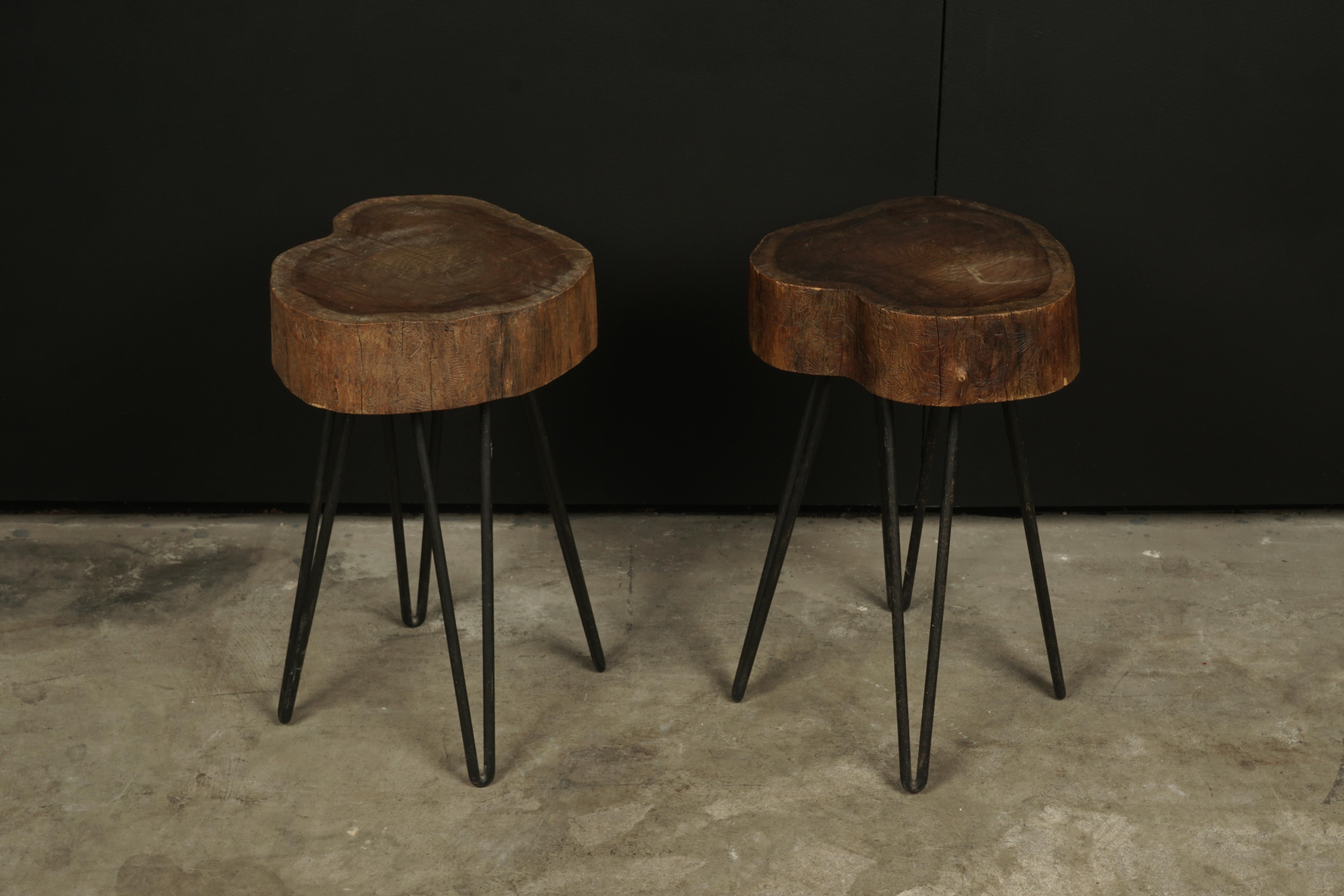 Vintage pair of tables from France, circa 1960. Solid wood top with metal hairpin legs. Nice wear and patina.