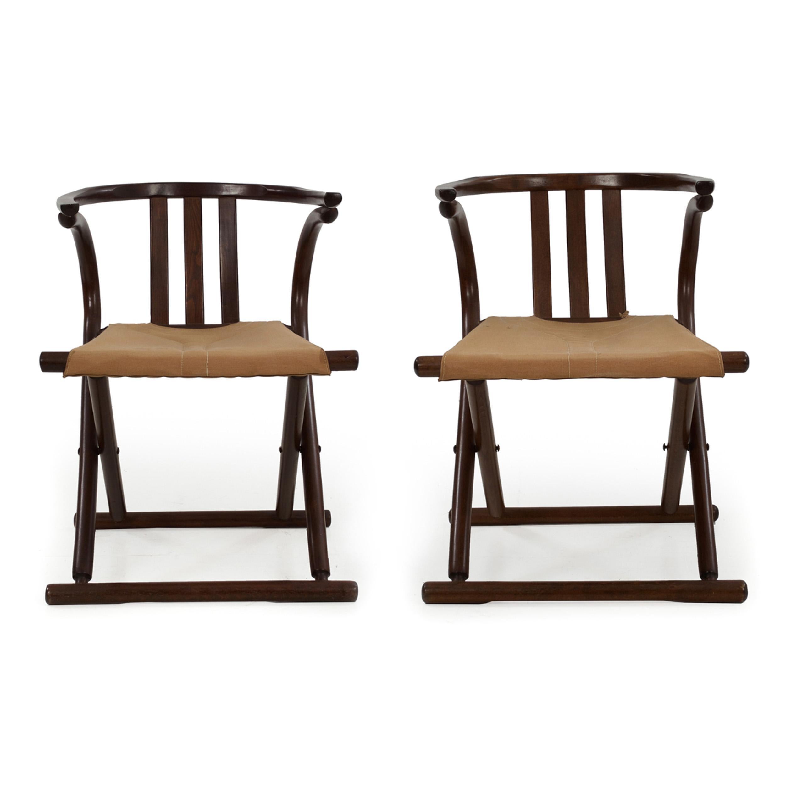 This is such a fun pair of bentwood chairs, crafted in the manner of Thonet during the third quarter of the 20th century and executed with fine attention to detail. The hooped arm rail comfortably supports the back, the lumbar supported against the