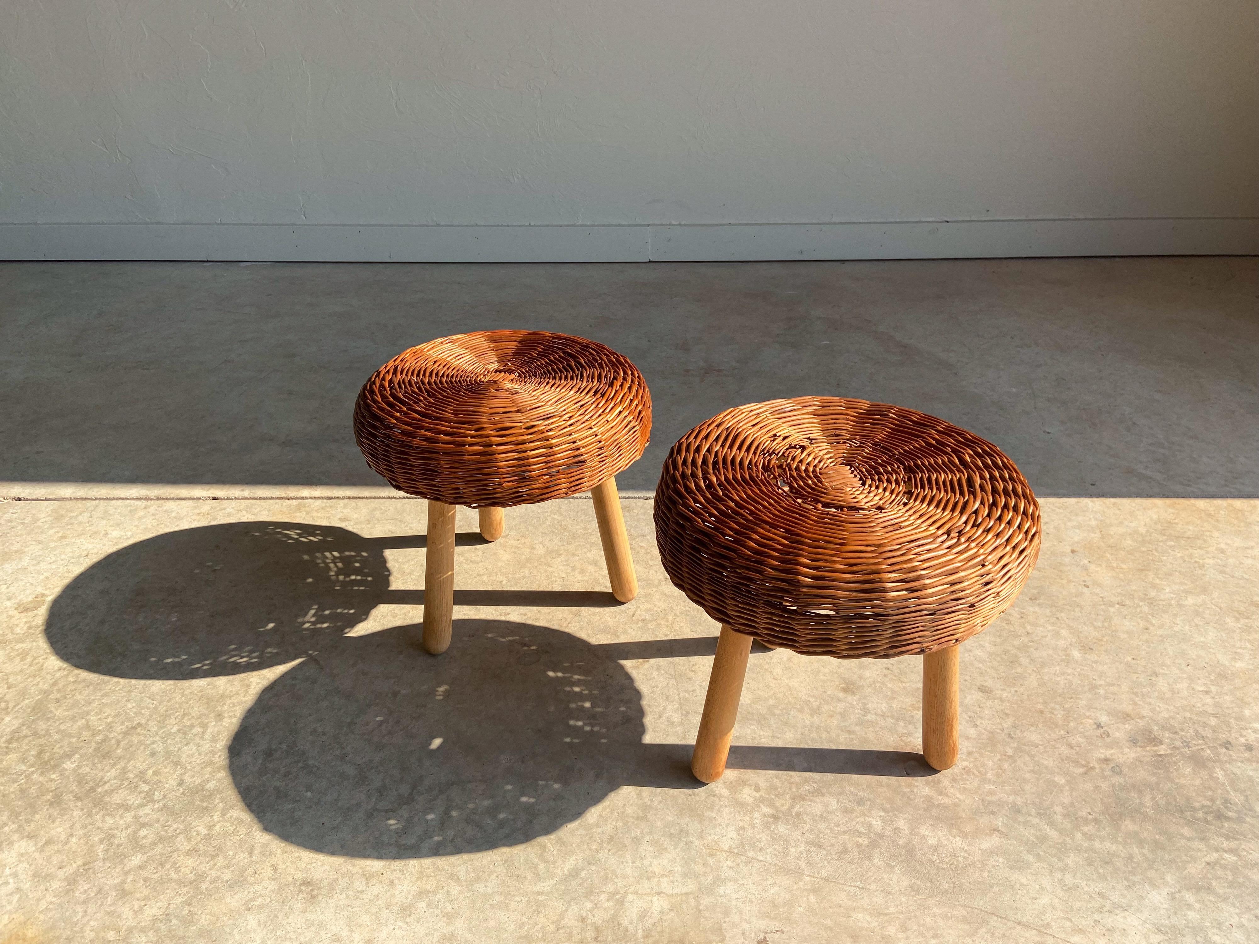 A wonderful pair of woven rattan/wicker and solid wood stools attributed to Tony Paul. 

Featuring hand woven rattan seats that sit upon a wood frame and solid birch legs. 

These make perfect accent pieces that are suitable in a variety of settings