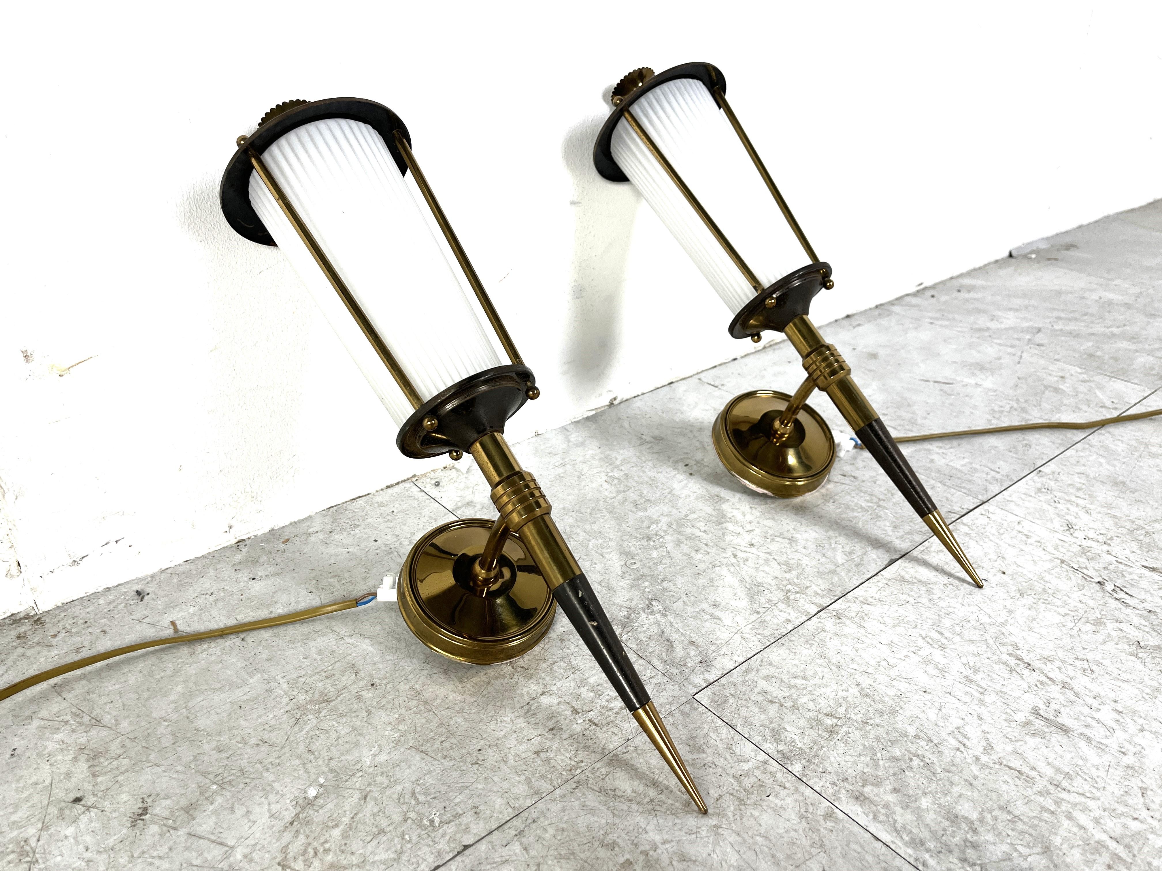 Mid century pair of wall sconces by Maison Arlus.

Very elegant mid century french design with brass, black metal and opal glass.

1950s - France

Tested and ready to use with two E14 lamps. 

Dimensions:
Height: 42cm/16.53