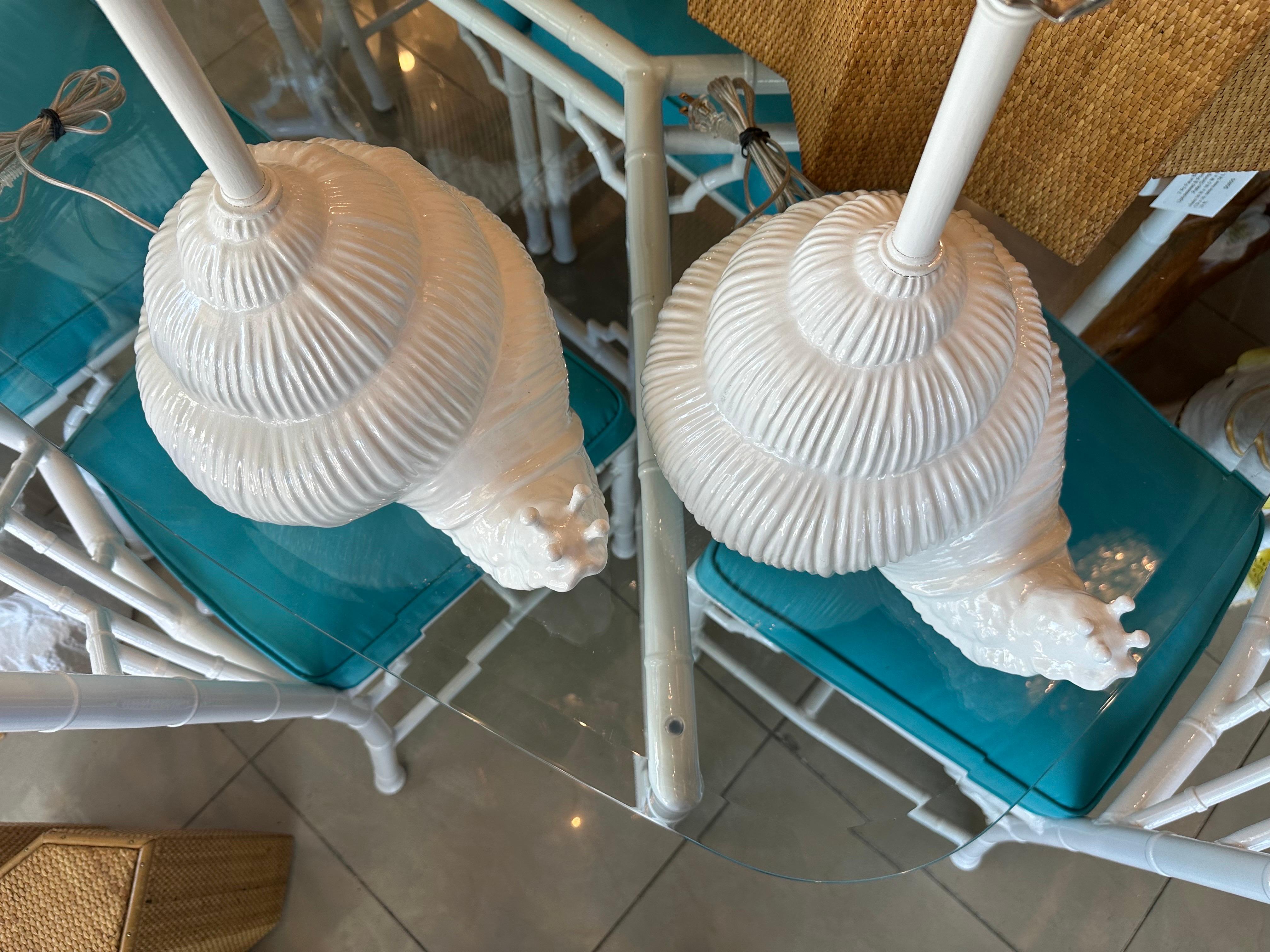 The cutest pair of vintage 1970s Italian ceramic snail lamps! Straight from Palm Beach. These have been newly wired, 3 way sockets, all new nickel hardware. No chips or breaks. Dimensions: 23 H (to top of finial) x 16.5 H (to top of lamp socket) x