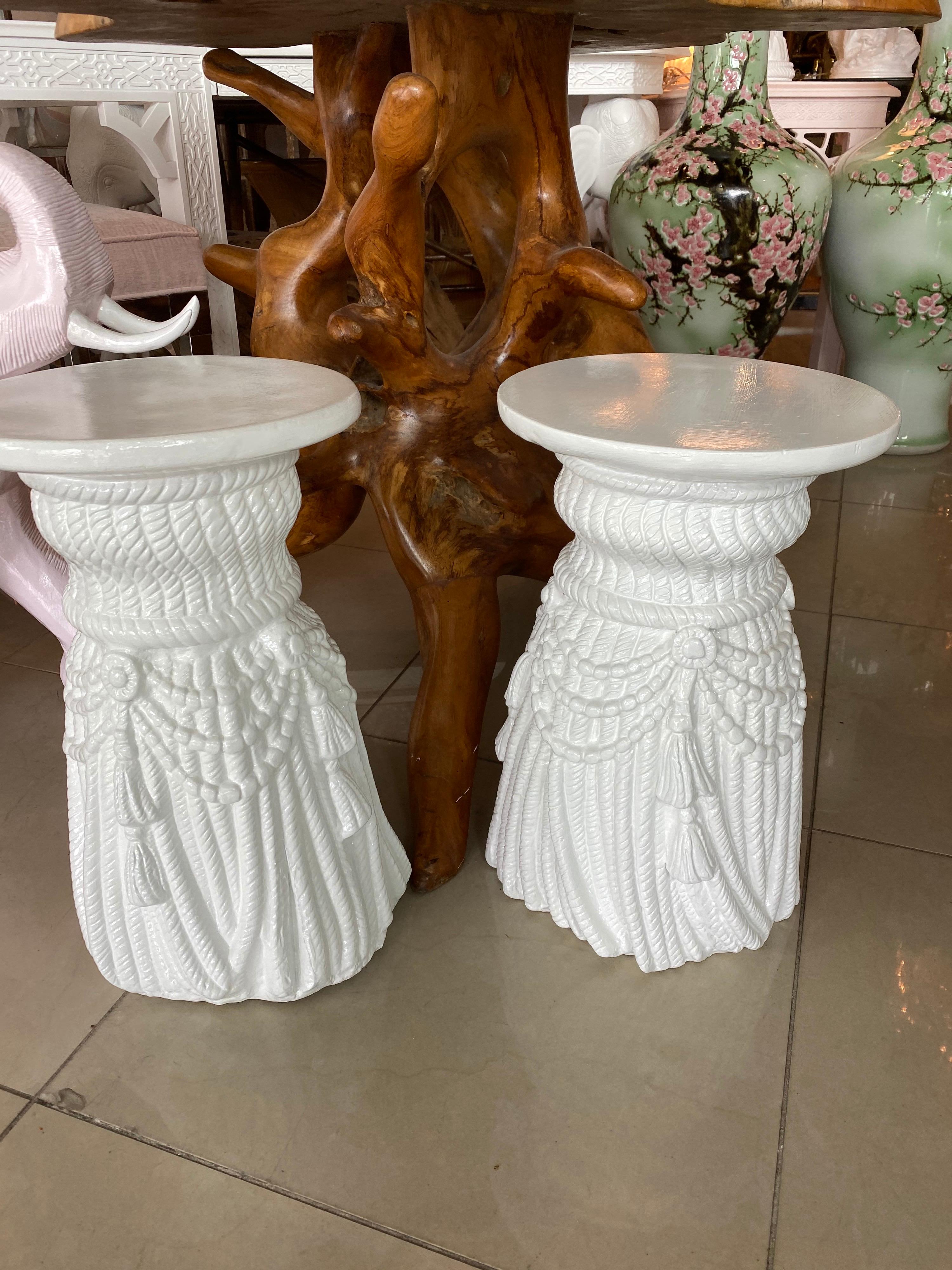 Lovely pair of vintage tassel draped garden stands stools. Would be so cute as drink tables. Plaster lacquered a clean crisp white. No chips or breaks. 
  