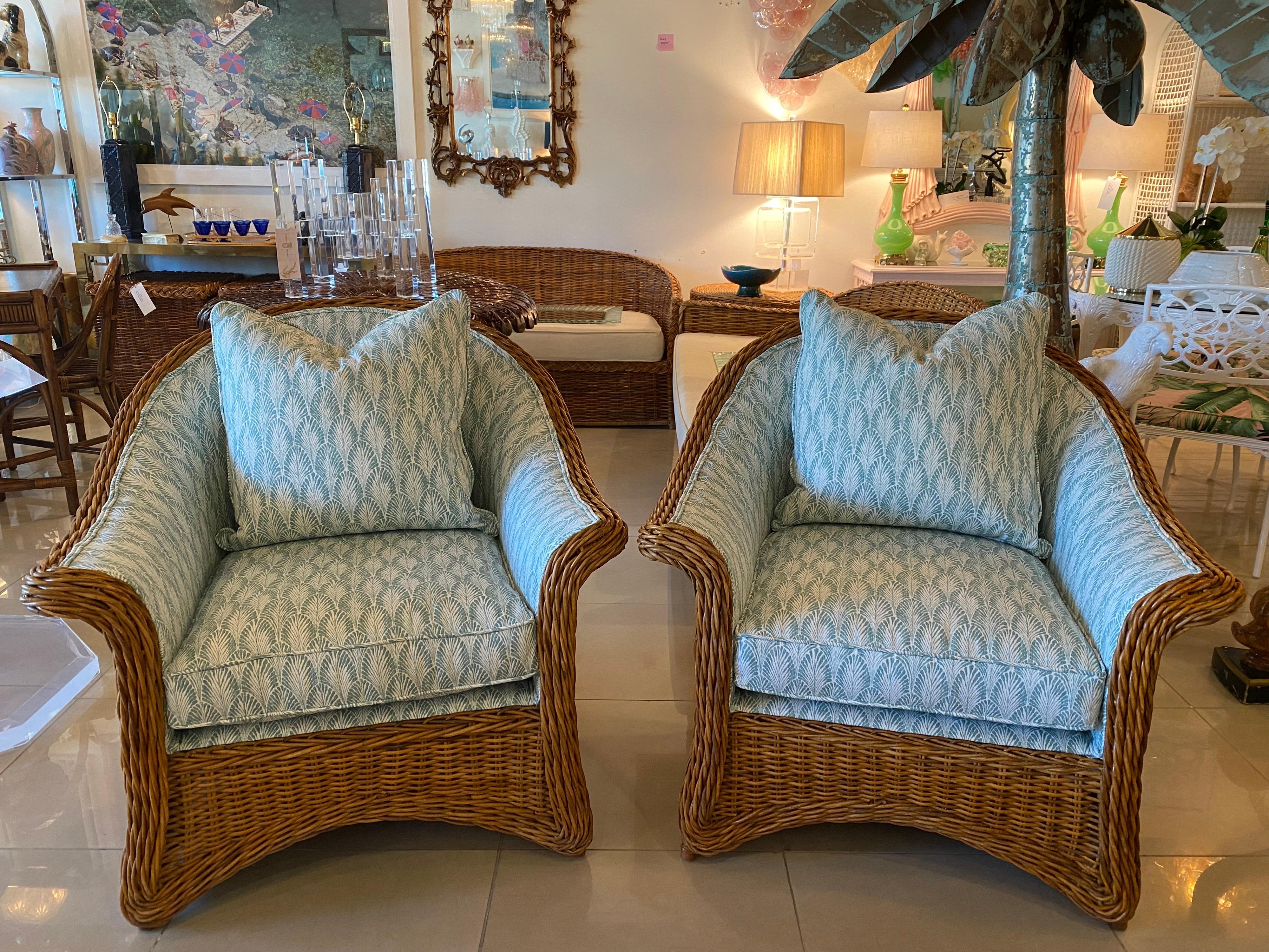 Beautiful pair of vintage rattan wicker woven armchairs, club, lounge chairs. These are very well made and very comfortable. Newly upholstered. Measures 34.5 H x 35.5 W x 32 Overall Depth x 17.5 Seat height.