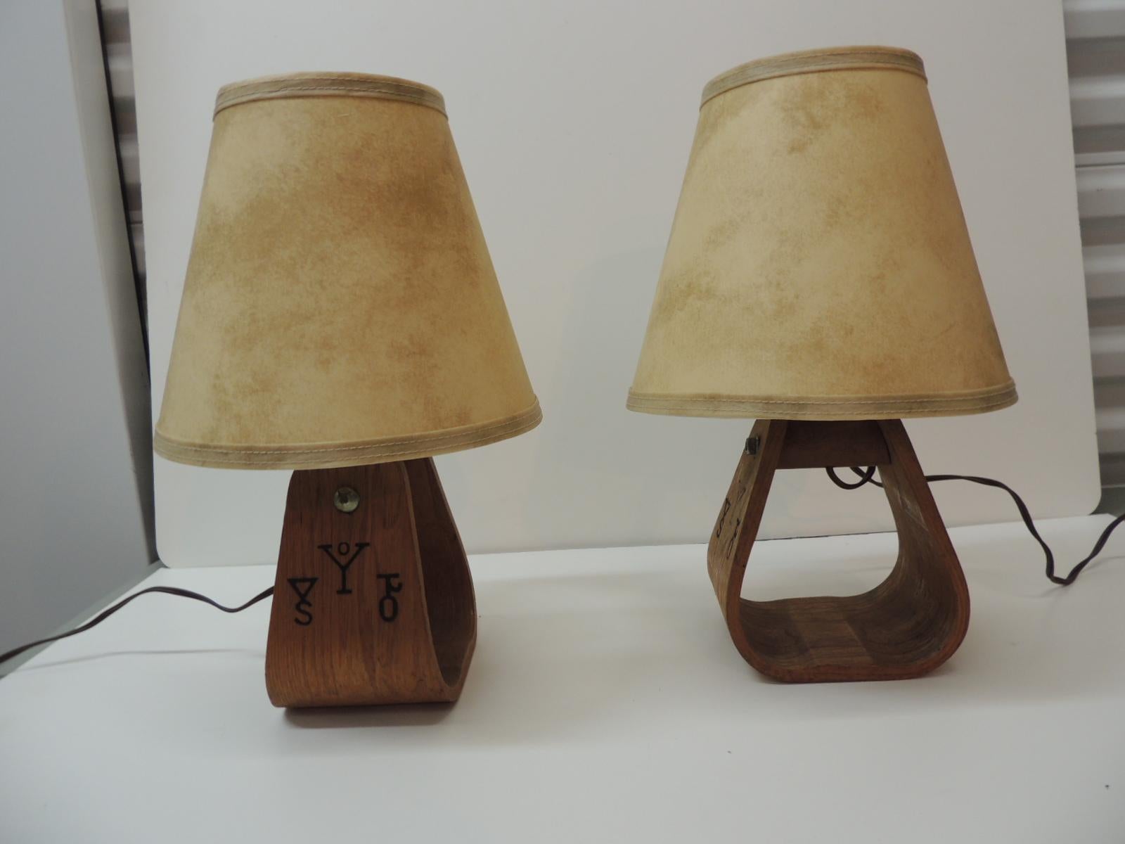 Vintage pair of wood horse Stirrup Petite table lamps with faux parchement style clip-on shades.
Size: 15H to shade
Base: 6 W x 4.5” x 12 to top of bulb
Shades: 8 x 9 H.