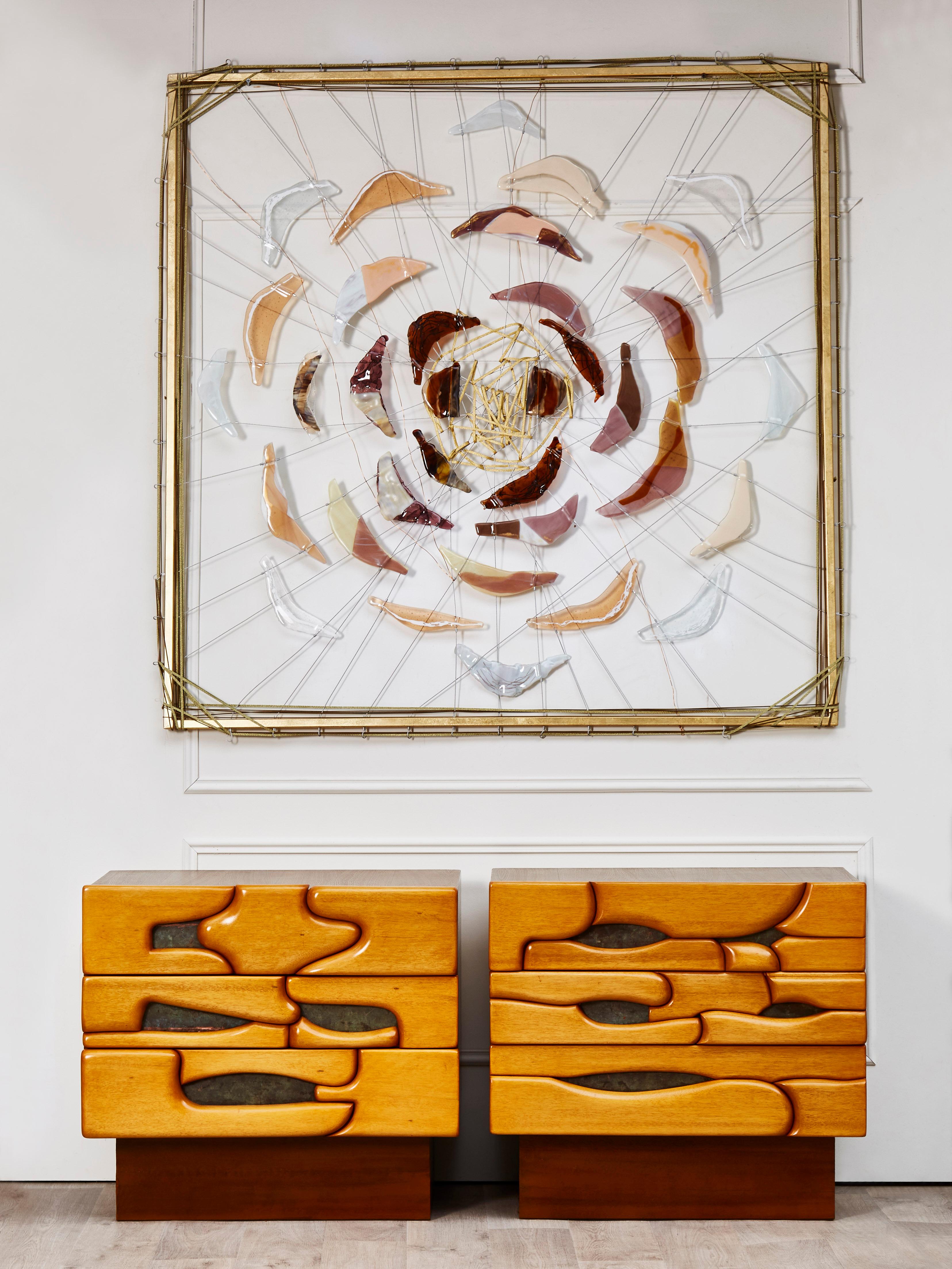 Stunning pair of vintage bedside tables in sculpted and polished wood. 3 drawers.
France, 1980.