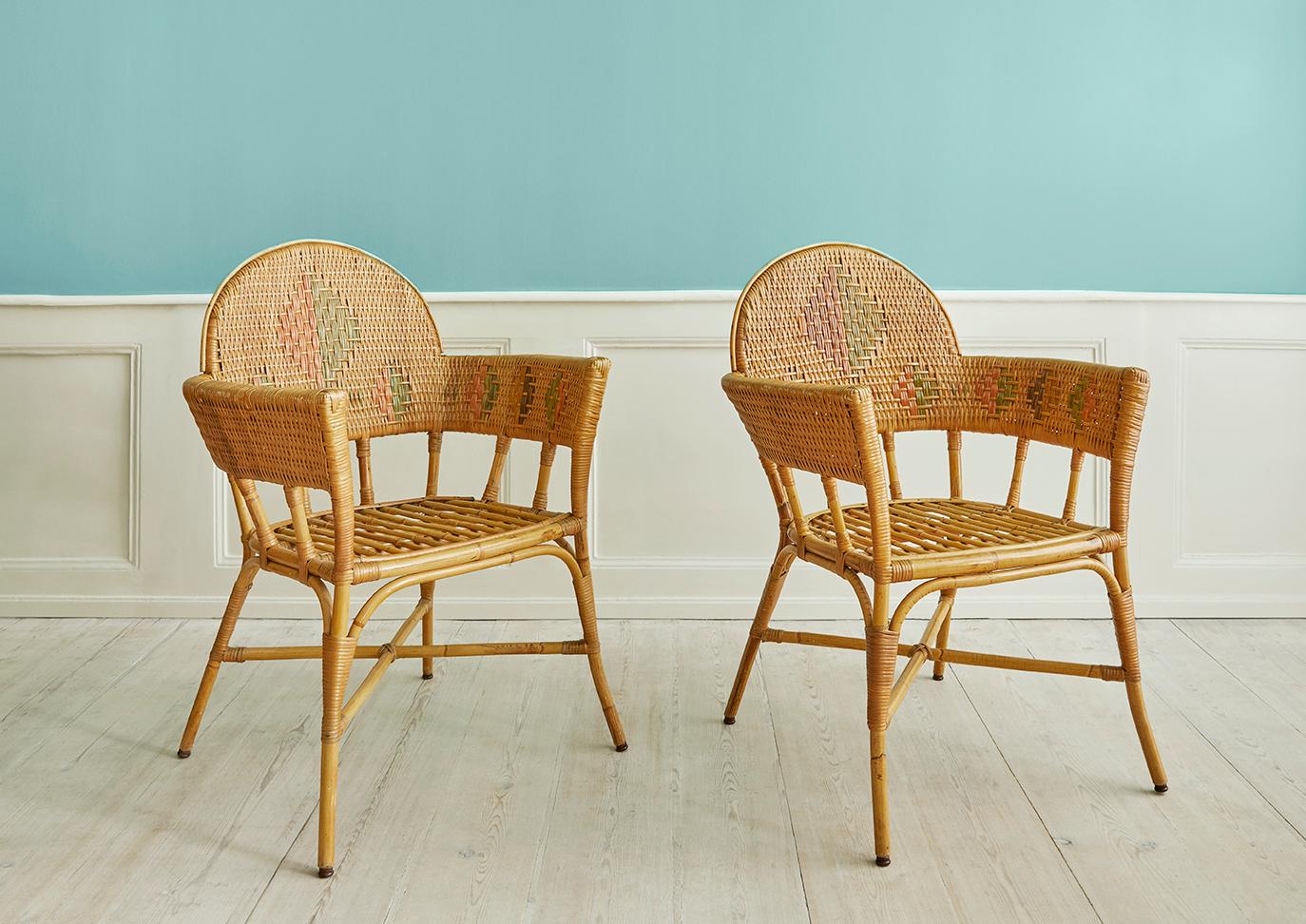 France, Early 20th Century

A pair of rattan chairs with elegant woven details.
Two pairs are available. 

H 91 x W 69 x D 60 cm