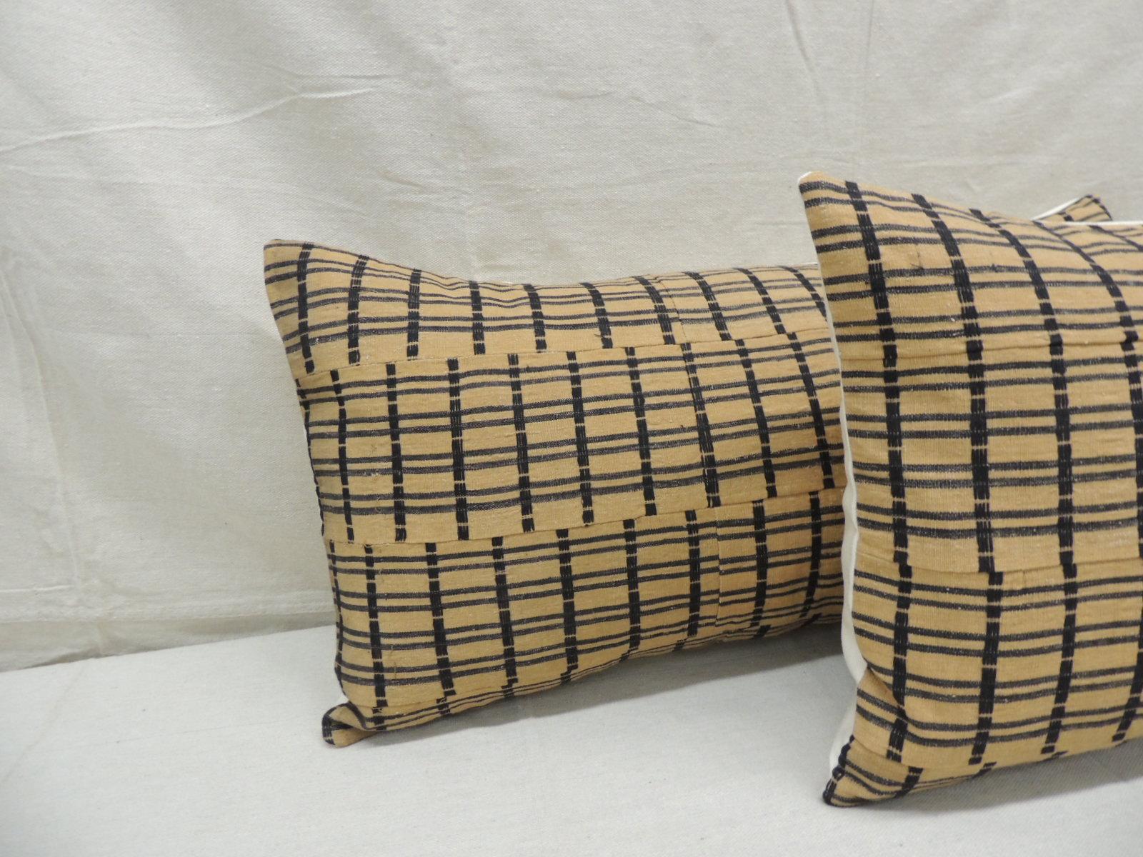 Vintage pair of yellow and dark blue African stripweaves long bolsters decorative pillows
with heavy woven linen backings.
Decorative pillow handcrafted and designed in the USA. 
Closure by stitch (no zipper closure) with custom made pillow