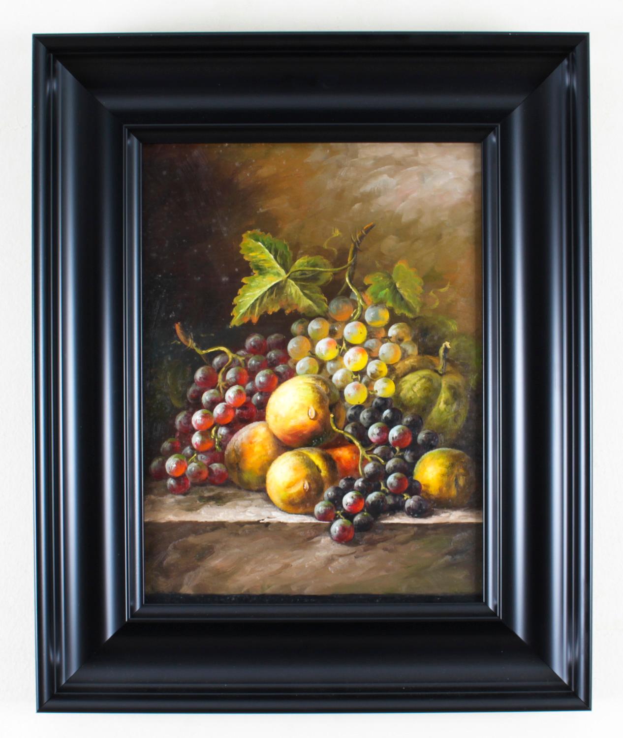 A delightful pair of vintage English oil on panel framed paintings in the Manner of Oliver Clare (1853-1927), mid 20th century in date.
The paintings present a pair of still lifes of fruit including grapes, melons and peaches, in a wicker basket on