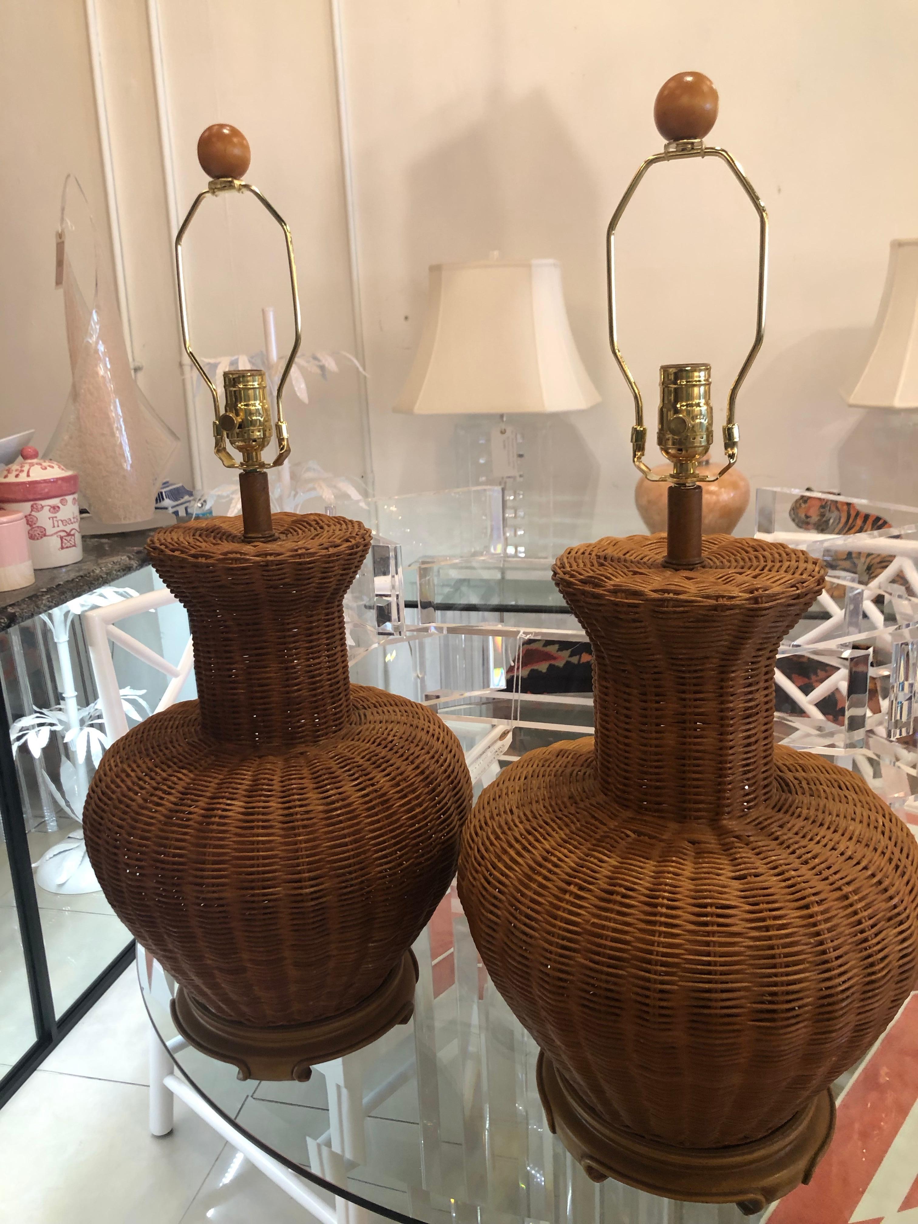 Lovely pair of large wicker ginger jar table lamps. All new wiring, sockets, and hardware. 
Height to finial is 28.5
Height to socket is 22.