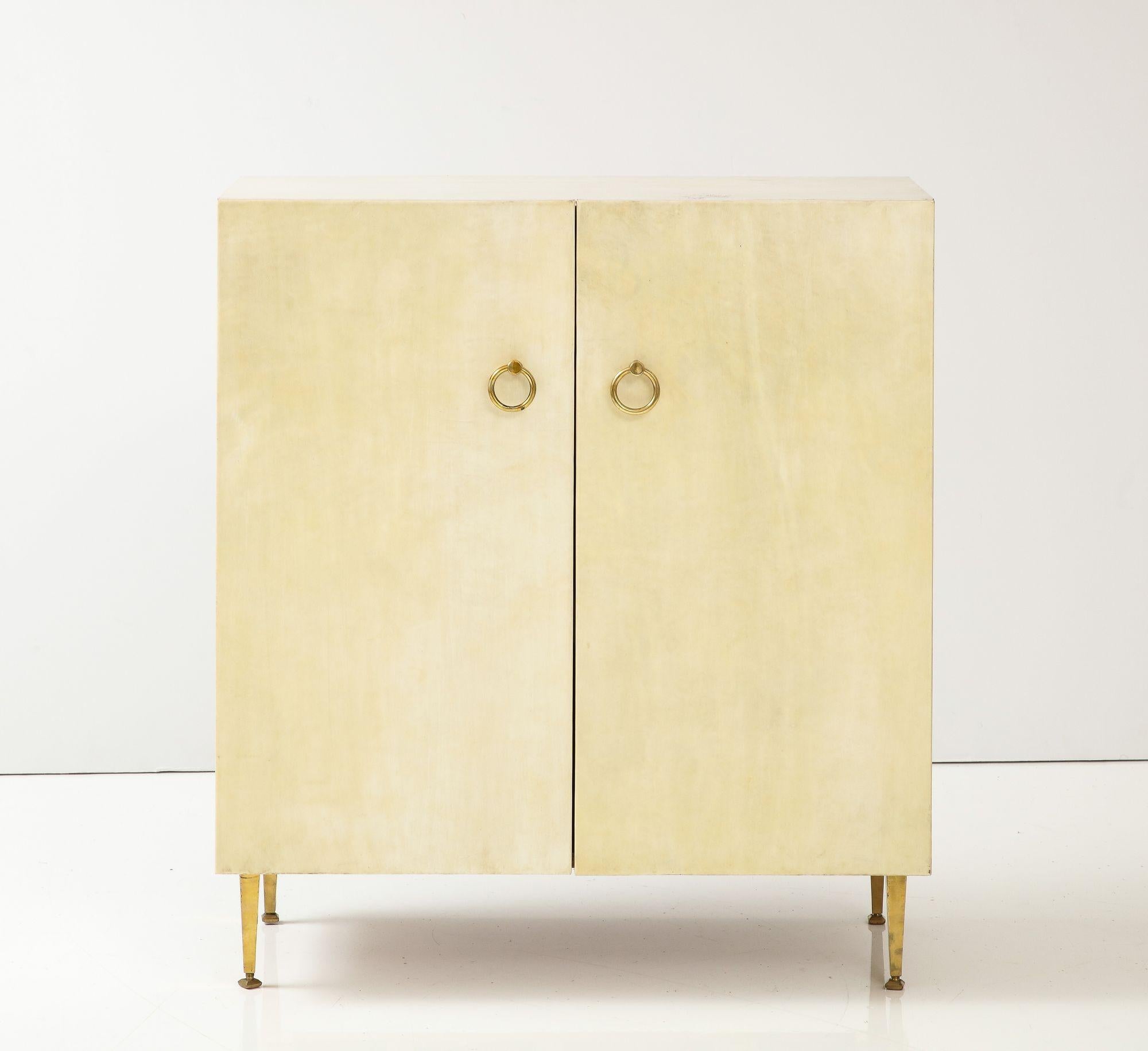 A pair of parchment covered cabinets in the manner of Samuel Marx circa 1950.Dimensions: Ht: 30