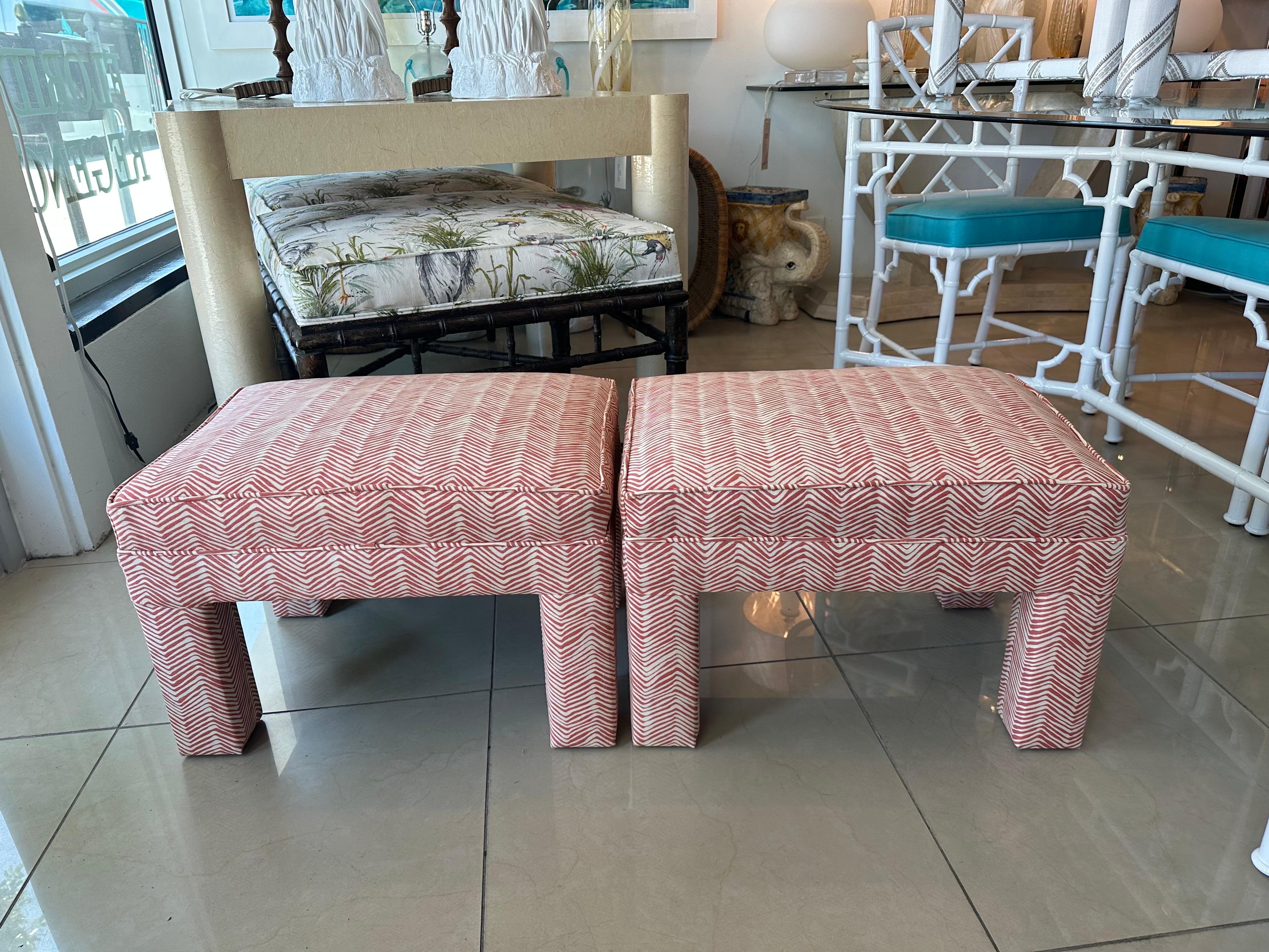 Wonderful pair of vintage 1970s parsons benches stools ottomans. In the style of Billy Baldwin. These have been newly upholstered a beautiful coral Quadrille fabric. Dimensions: 15.5 H x 16.5 D x 22.5 W.