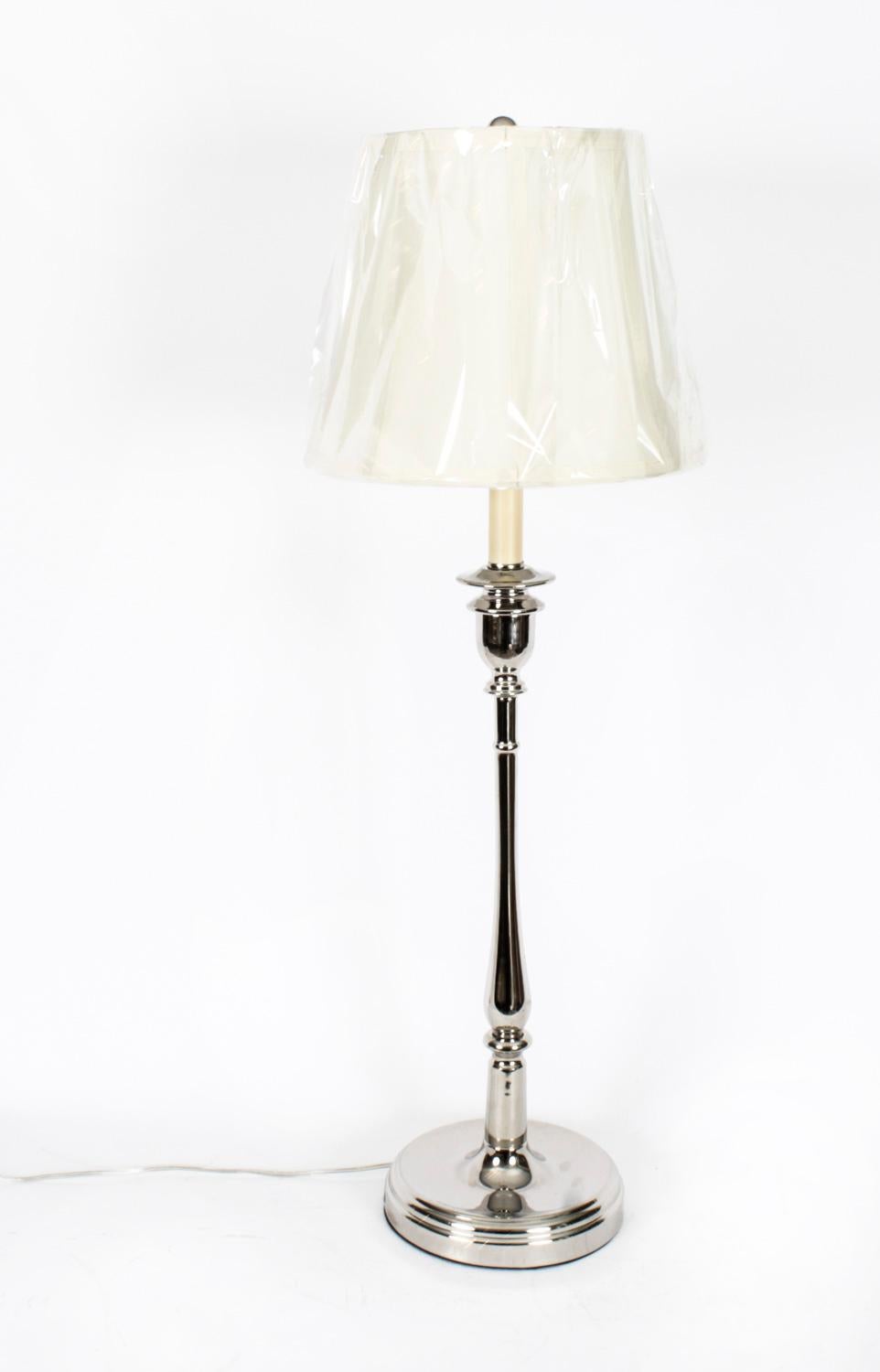 This is a highly attractive and stylish pair of Ralph Lauren chrome table lamps, late 20th Century in date.
 
This splendid pair is crafted from polished nickel and mounted on a circular base.
 
The craftsmanship is second to none throughout all