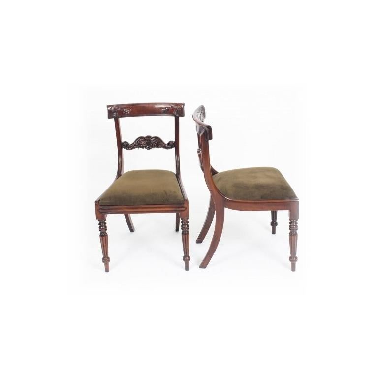 A superb English made pair of Regency Revival side chairs dating from the late 20th century.

These chairs have been masterfully hand crafted in beautiful solid flame mahogany throughout and the finish and attention to detail on display are truly
