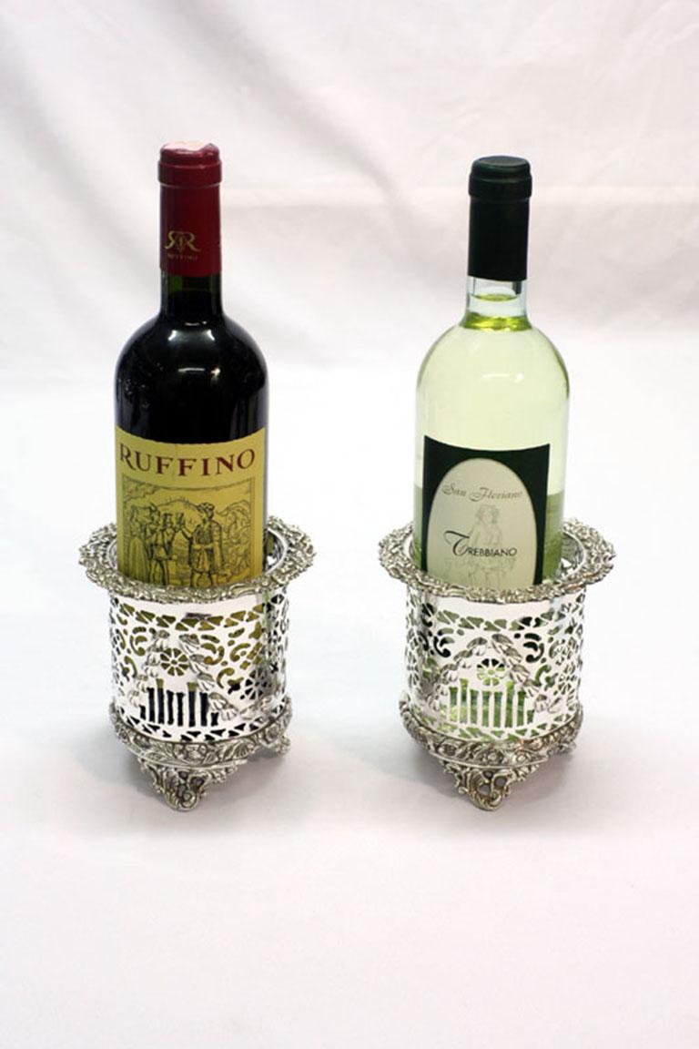 A very attractive pair of silver plated wine coasters with pierced and embossed decoration in the classic English style.

A highly versatile pair which could also serve as grandiose pen holders.

Add an elegant touch to your next dining