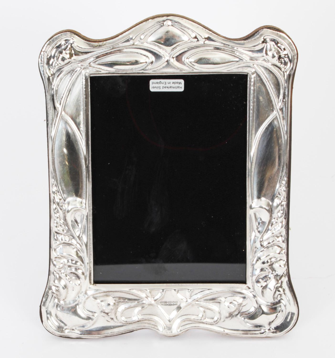 A truly superb pair of Vintage Art Nouveau sterling silver photo frames, by Harry Frane, London Dated 2011

The beautiful shaped rectangular photo frames are superbly decorated with typical Art Nouveau decorations stylised flowers.

An excellent