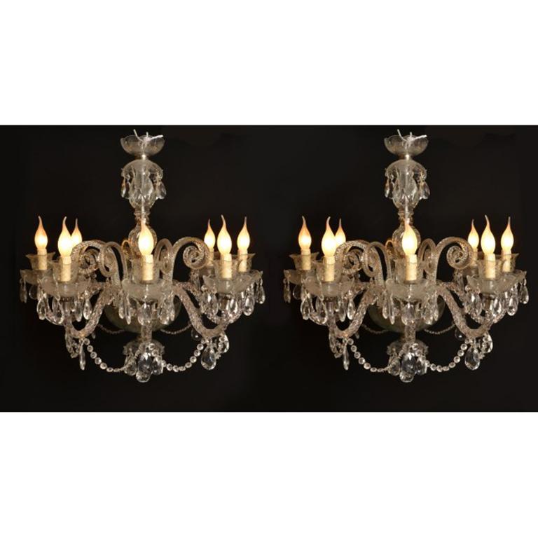 This is a stunning vintage pair of Venetian style crystal chandeliers with eight lights, dating from the second half of the 20th Century.

Add an elegant touch to your home with this beautiful pair of highly decorative