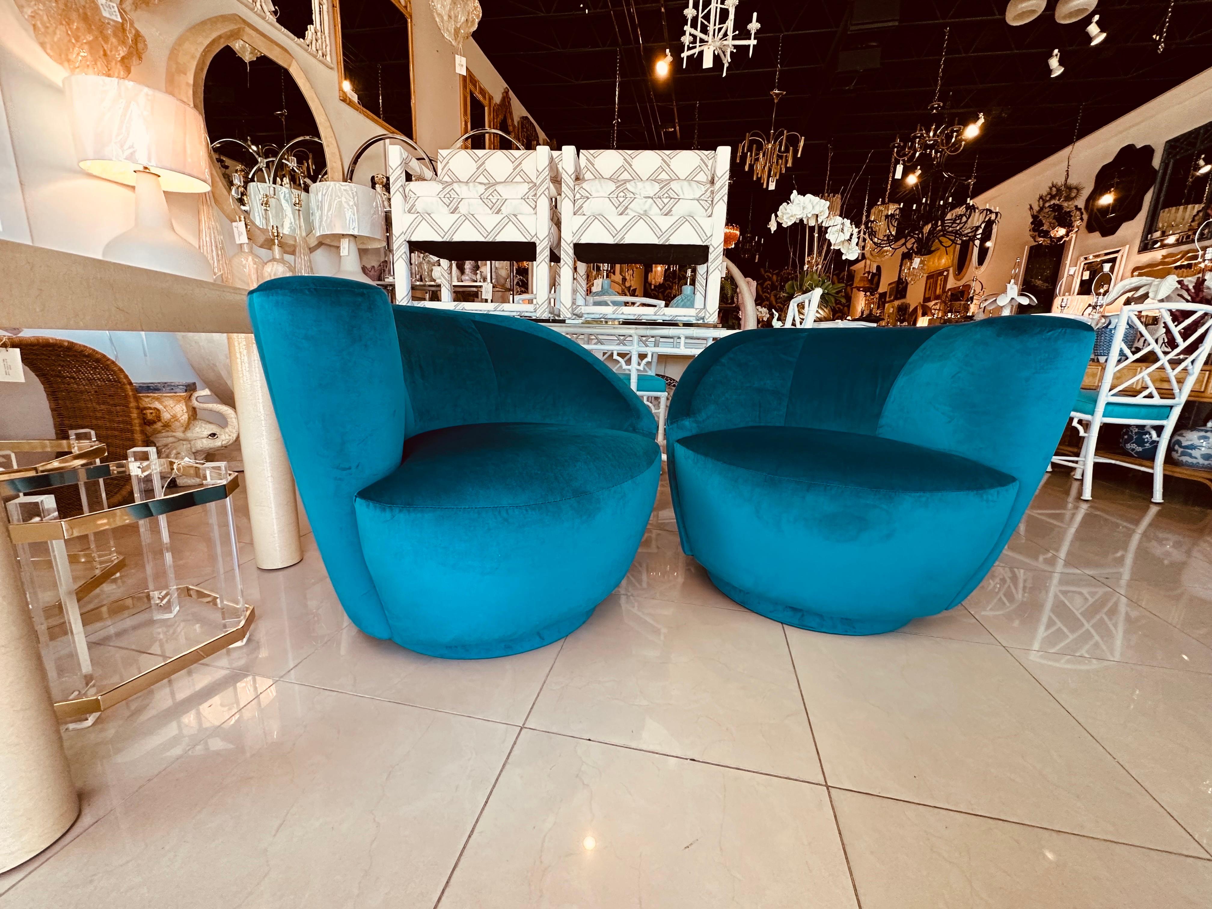 Amazing pair of Vladimir Kagan for Directional swivel arm chairs, nautilus corkscrew design. These have been newly upholstered in a beautiful teal blue velvet. Dimensions: 29 H x 34.5 W x 16 seat height x 22 cushion depth x 34 overall depth.