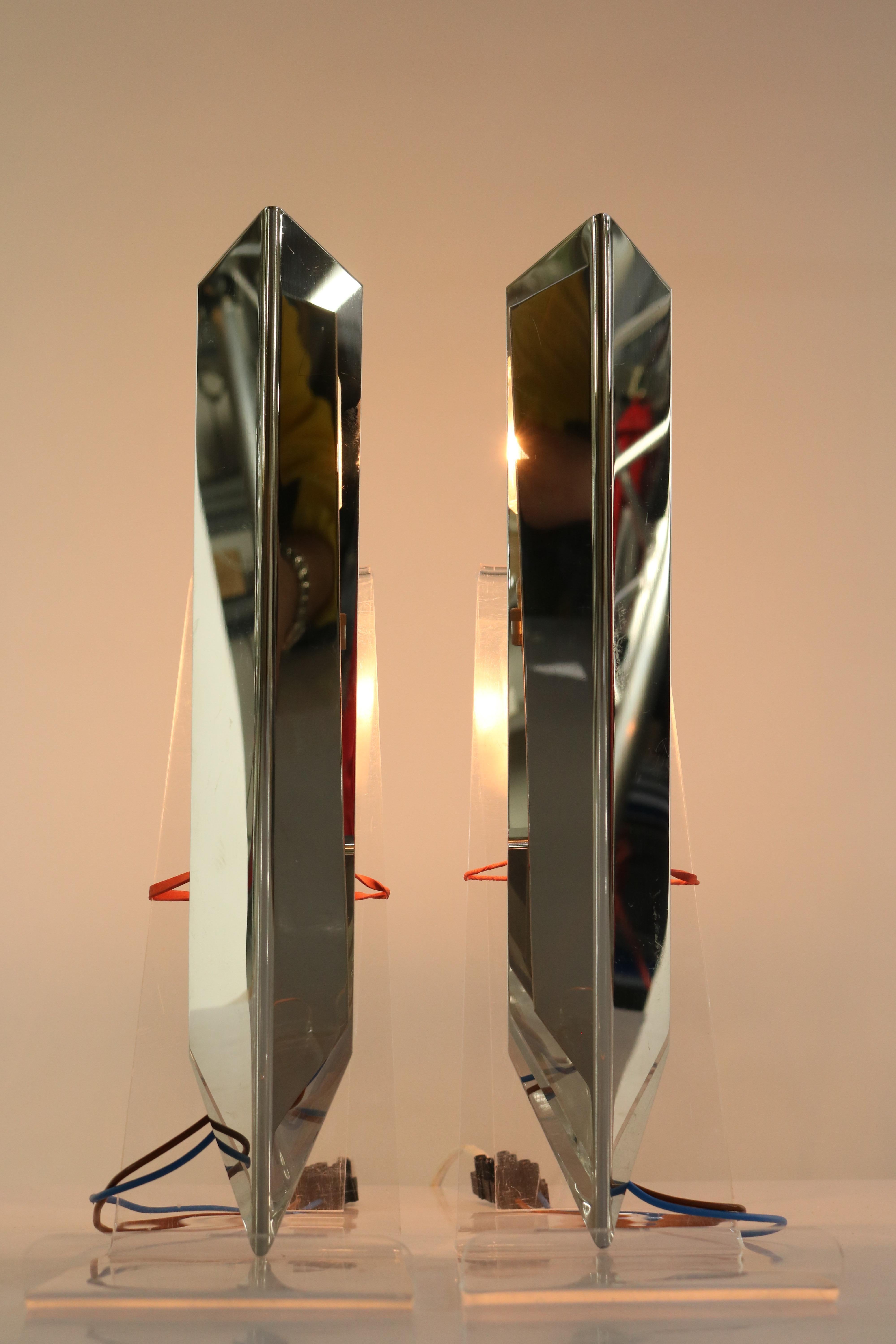 A pair of rare J.T. Kalmàr wall sconces 
made in Austria of chromed steel 
in very fine condition
you need two bulbs B 15 socket to operate
they are not included in this offer

Measures: Height 12 1/3'', width 2 1/4'', depth 6'', weight 0.6 kg