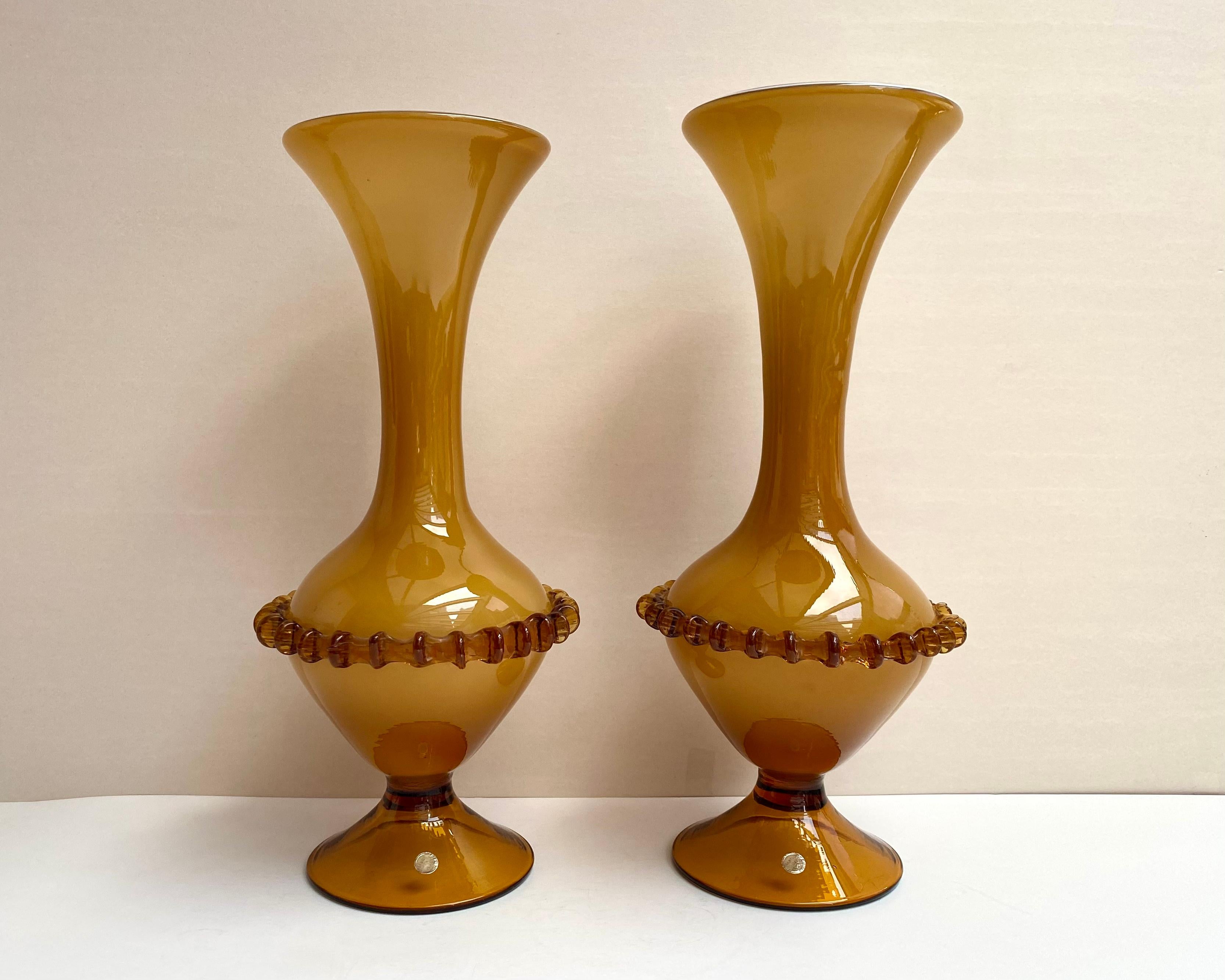 Bright, unusual vases with an interesting shape are made of Murano Glass in yellow ocher color of the highest quality. Italy.

Hand crafted vases will become an original decoration of any interior. It is impossible not to fall in love with