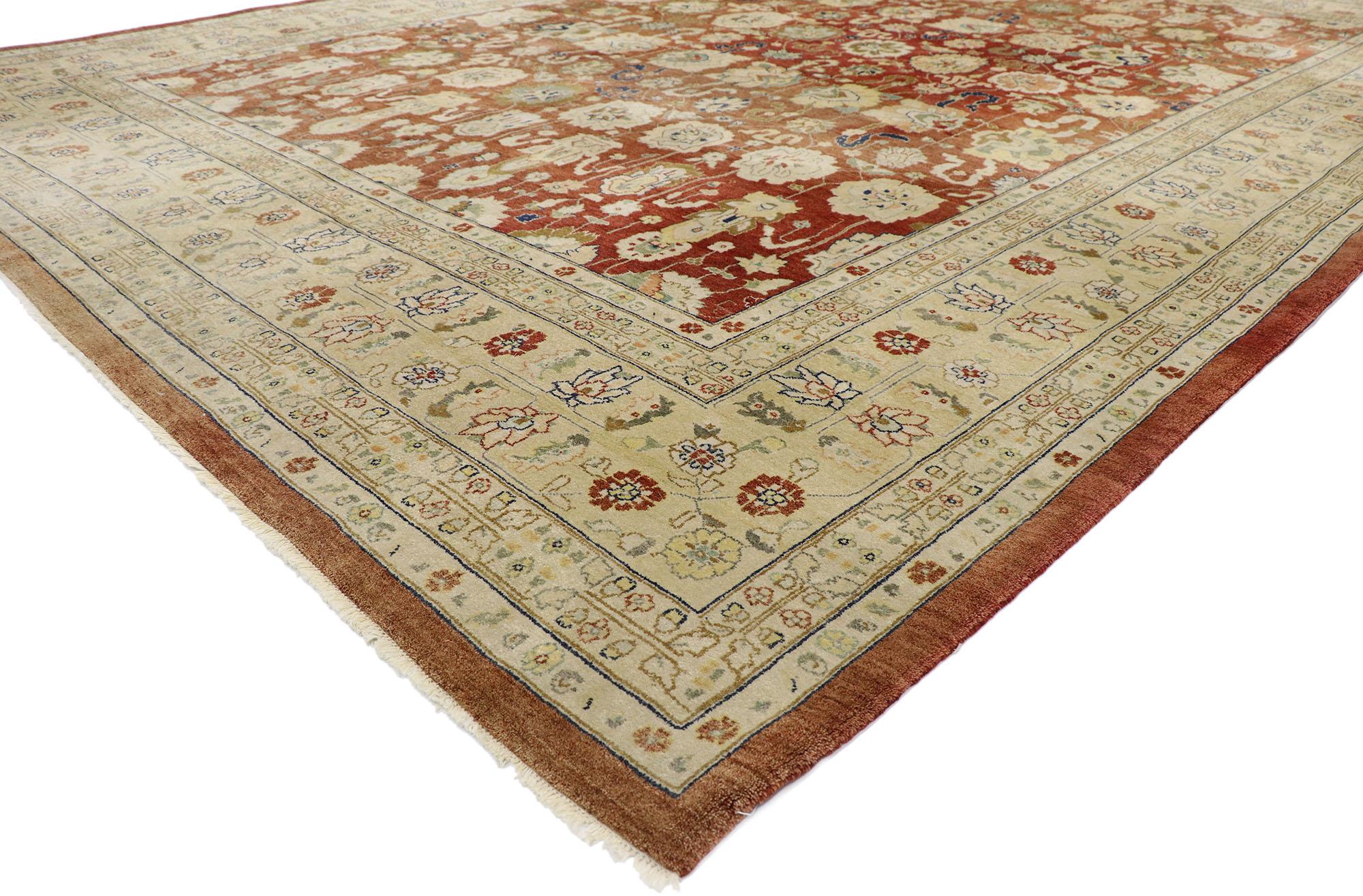77577 vintage Pakistani rug with Rustic Arts & Crafts style. With its timeless design and warm earth-tone colors, this hand-knotted wool vintage Pakistani rug astounds with its beauty. The abrashed field is covered in an all-over botanical pattern
