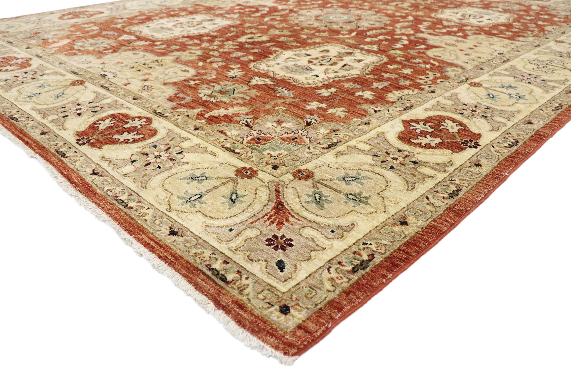77789 vintage Pakistani rug with Traditional style 08'11 x 12'00. With its timeless design and warm earth-tone colors, this hand-knotted wool vintage Pakistani rug astounds with its beauty. The abrashed rust colored field features an eight point