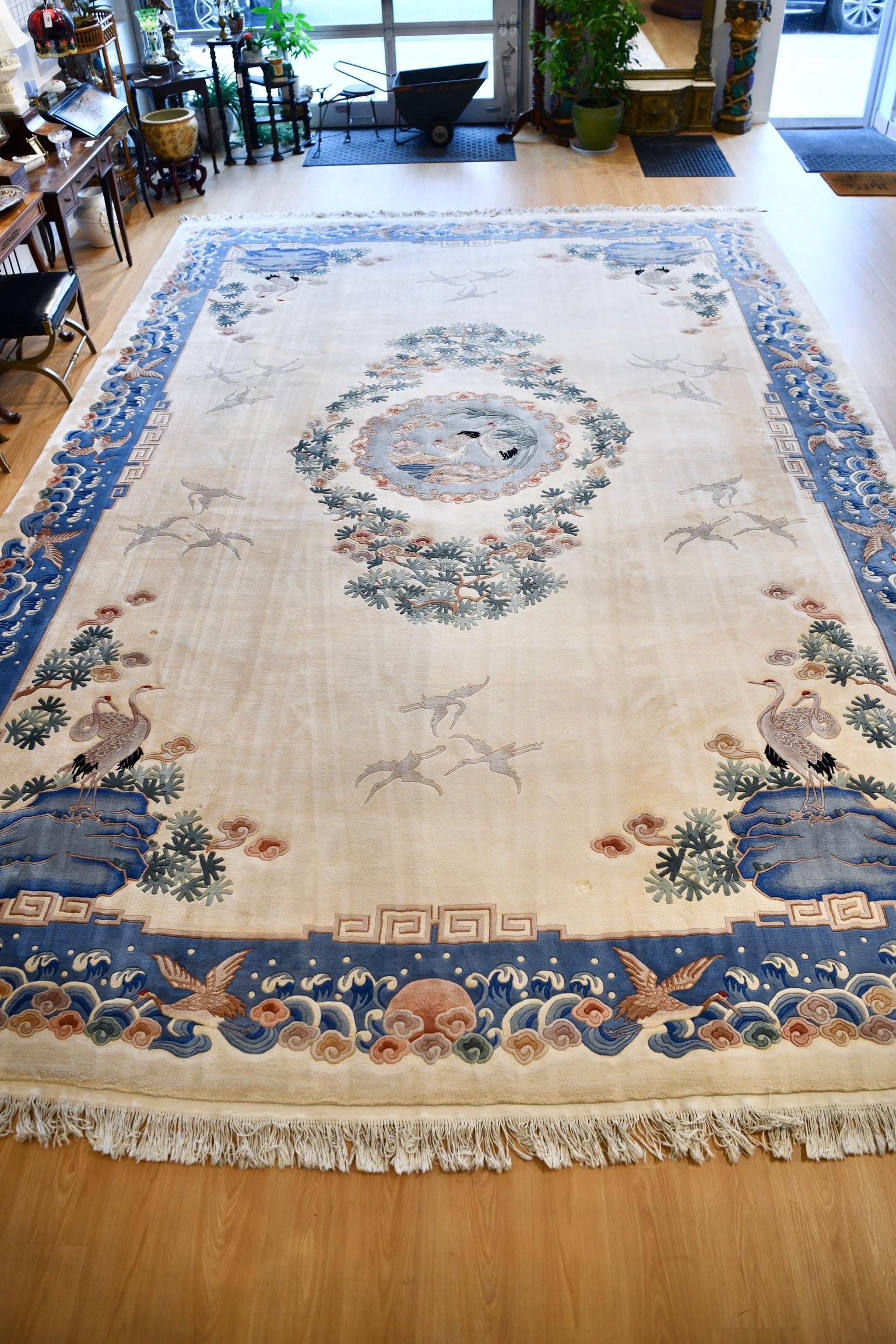 Vintage palatial size Chinese rug with florals, cranes and nature design. In excellent vintage condition with minor wear. Dimensions: 18' x 12'.