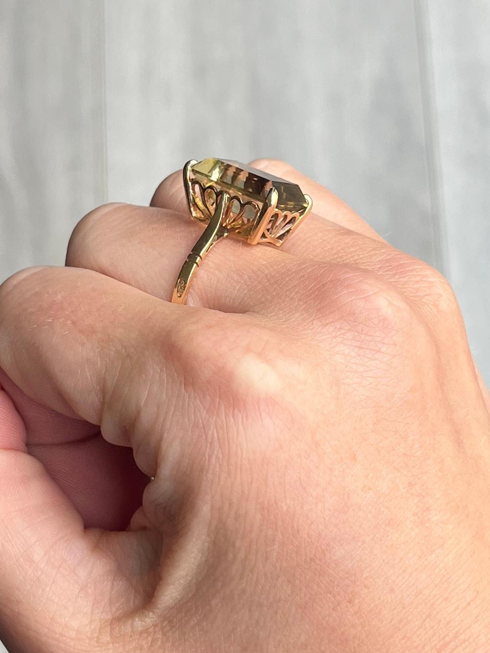The pale green/yellow tourmaline is gorgeous and set simply up high in this 18 carat gold ring which has simple shoulders.

Ring Size: Q or 8 1/4 
Height Off Finger: 9mm
Stone Diameter: 16x12mm

Weight: 6.1g

