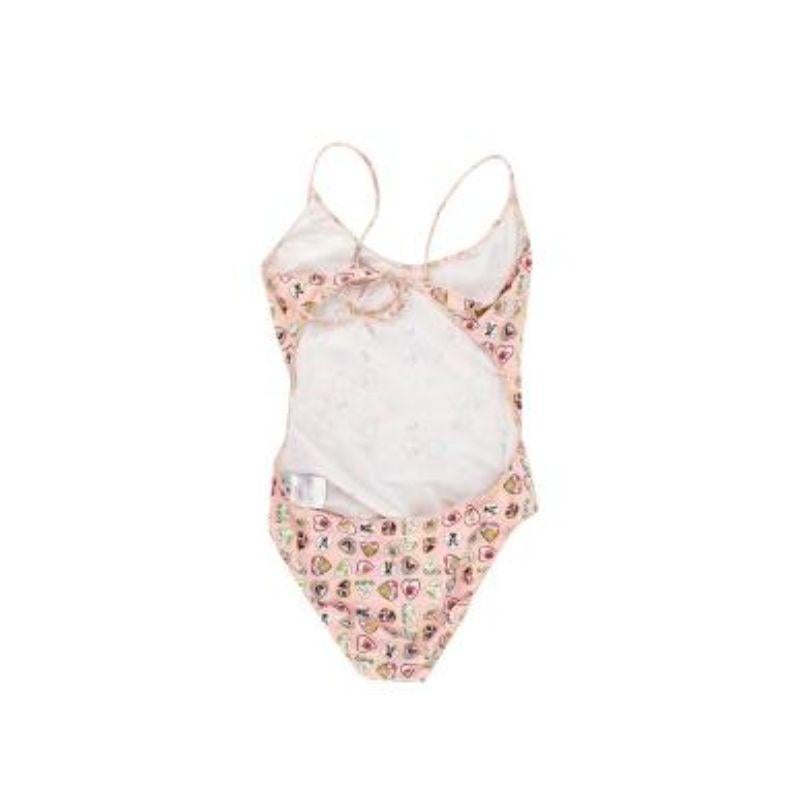 Chanel vintage pale pink Coco love heart print swimsuit
 

 - Playful heart printed swimsuit with scoop neck and cut-out back
 - High cut leg
 - Tie back fastening
 - Fully lined
 

 Materials:
 75% Nylon 
 25% Elastane 
 

 Made in France 
 Machine