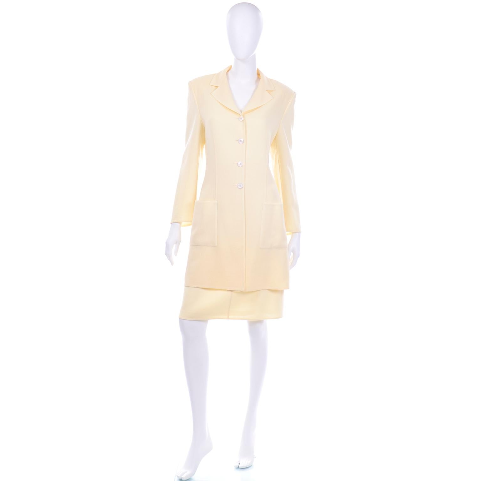 This is a beautiful shimmer pale yellow crepe skirt suit from Salvatore Ferragamo. The fabric is very unique, because it has a clear thin tinsel-like-thread woven through the crepe fabric. The color is a stunning muted pale yellow that is excellent