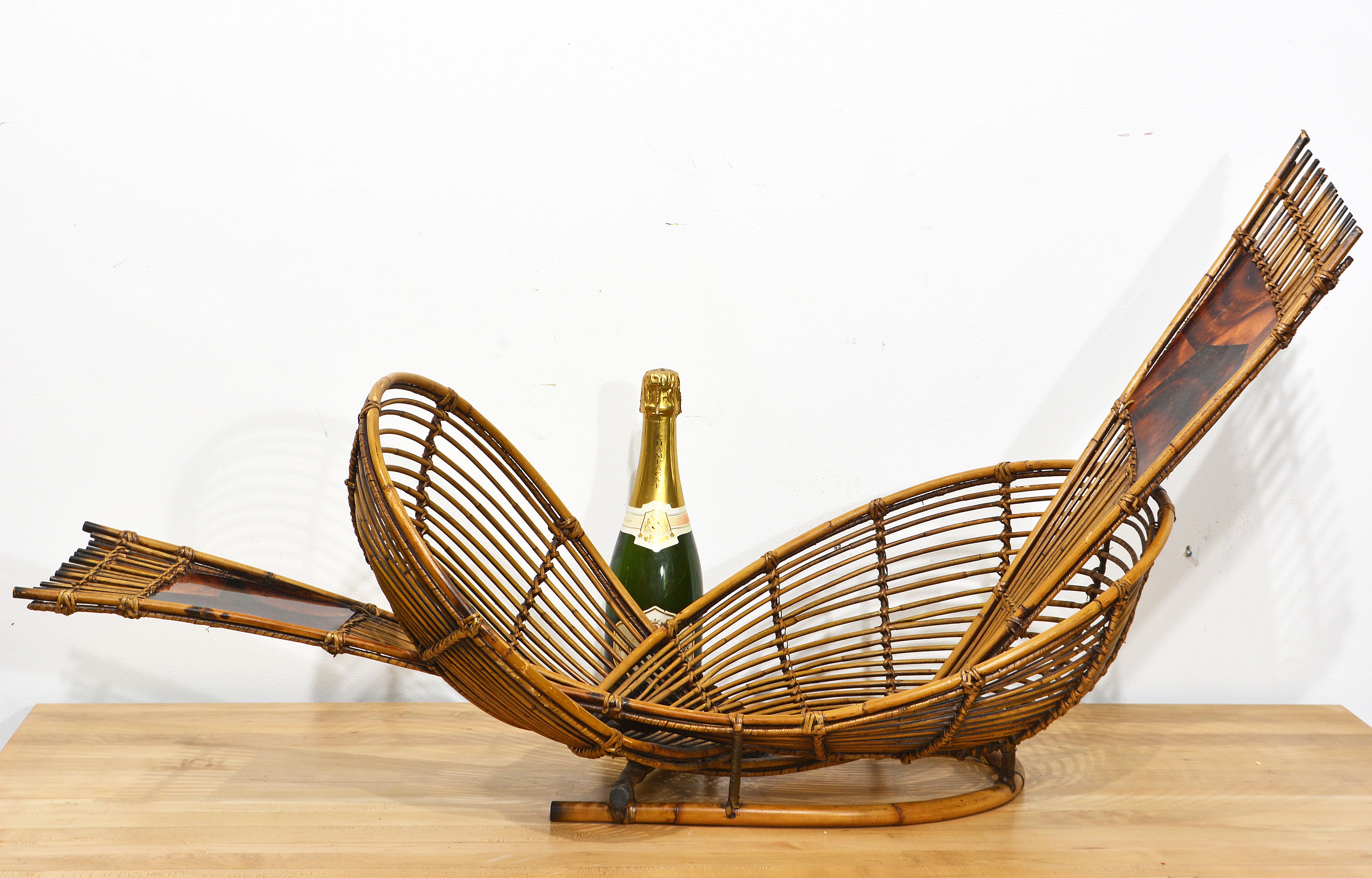 Shaped as a sculpture reminiscent of the ancient infinity symbol this centerpiece or fruitbowl by the high end Palecek of San Francisco is an absolute feast for the eyes. Carefully constructed after old traditions of pencil reed, bent rattan and pen
