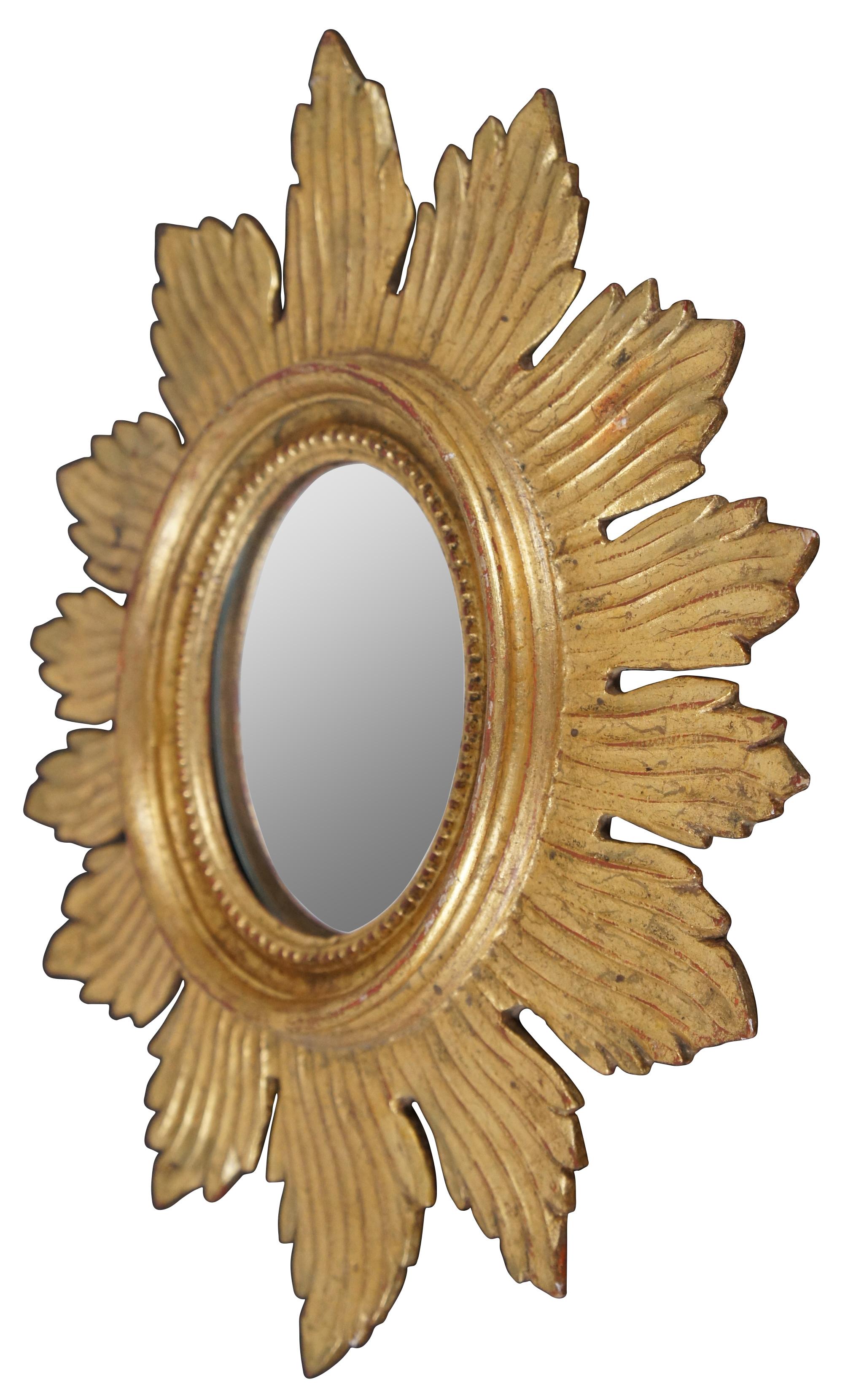 Small Palladio Italian giltwood wall mirror with Hollywood Regency frame shaped like a sun. Measure: 17