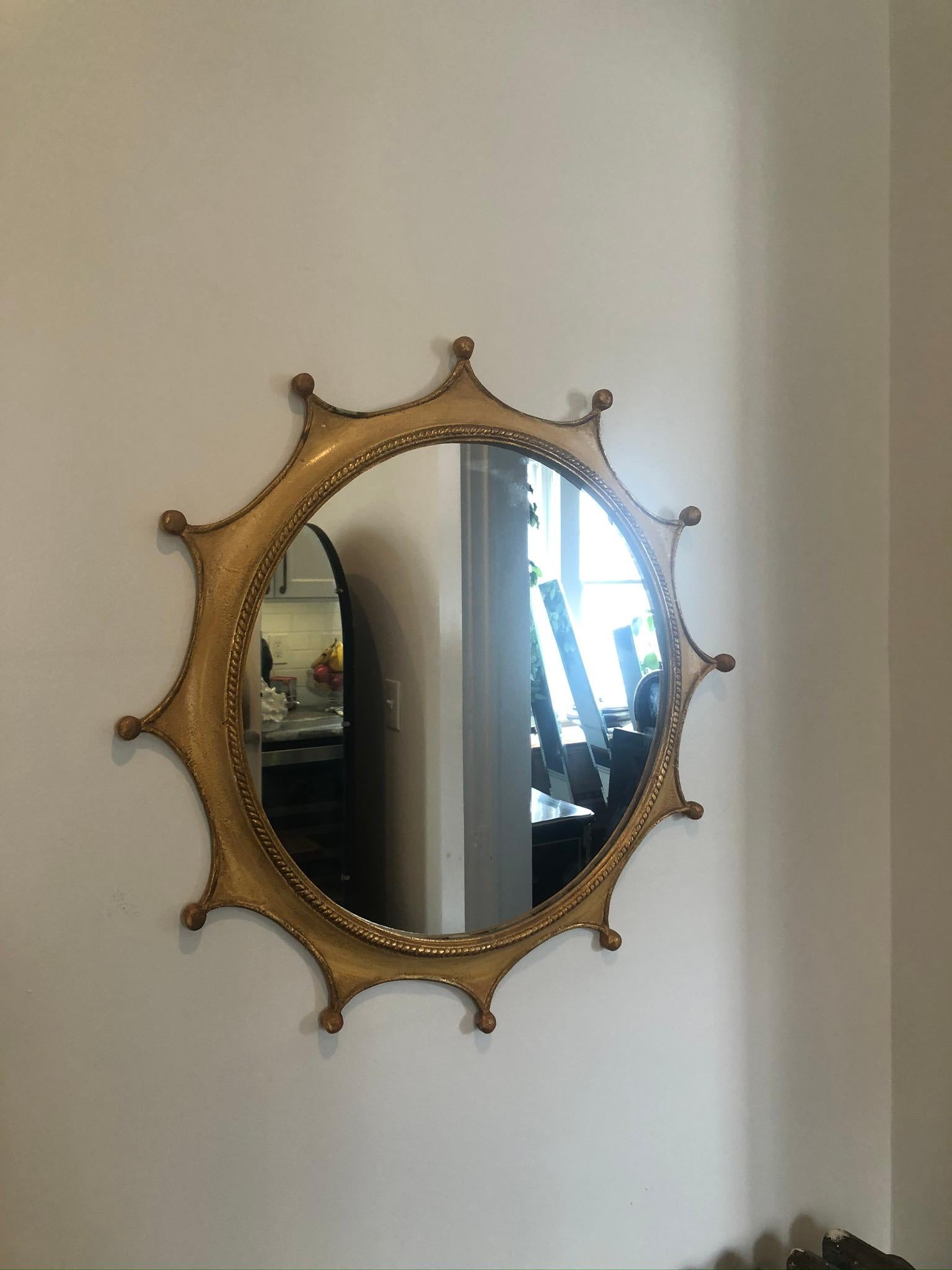 Stunning whimsical Palladio mirror made in Italy. Metal frame with crown or sunburst design complimented with an internal roping accent. Nicely patinated.