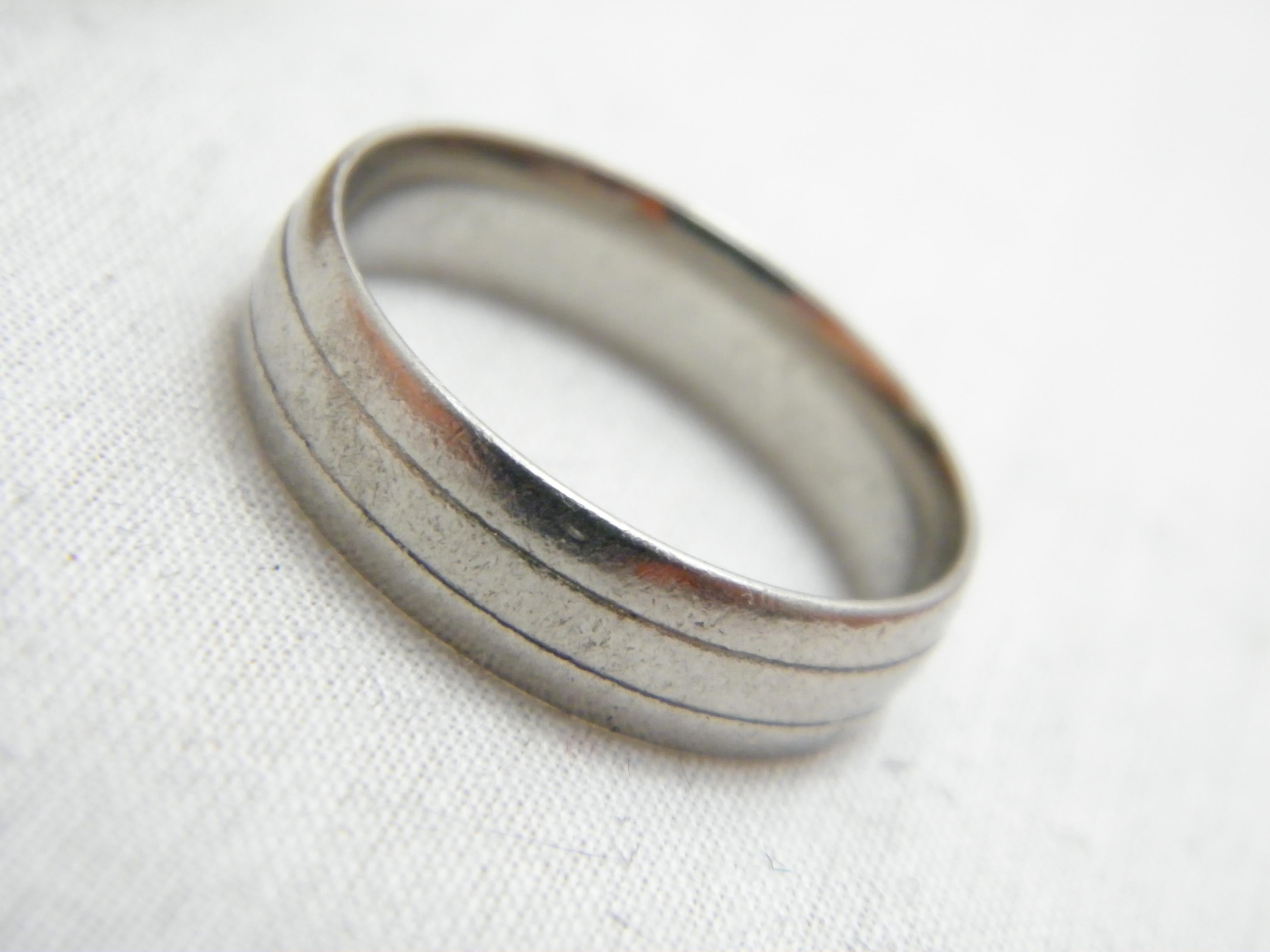 If you have landed on this page then you have an eye for beauty.

On offer is this gorgeous
VINTAGE PALLADIUM BEVELLED BURNSIHED WEDDING BAND RING

Crafted from solid Palladium (950/000)
and bespoke assay marked in London, UK dating to late 20th
It