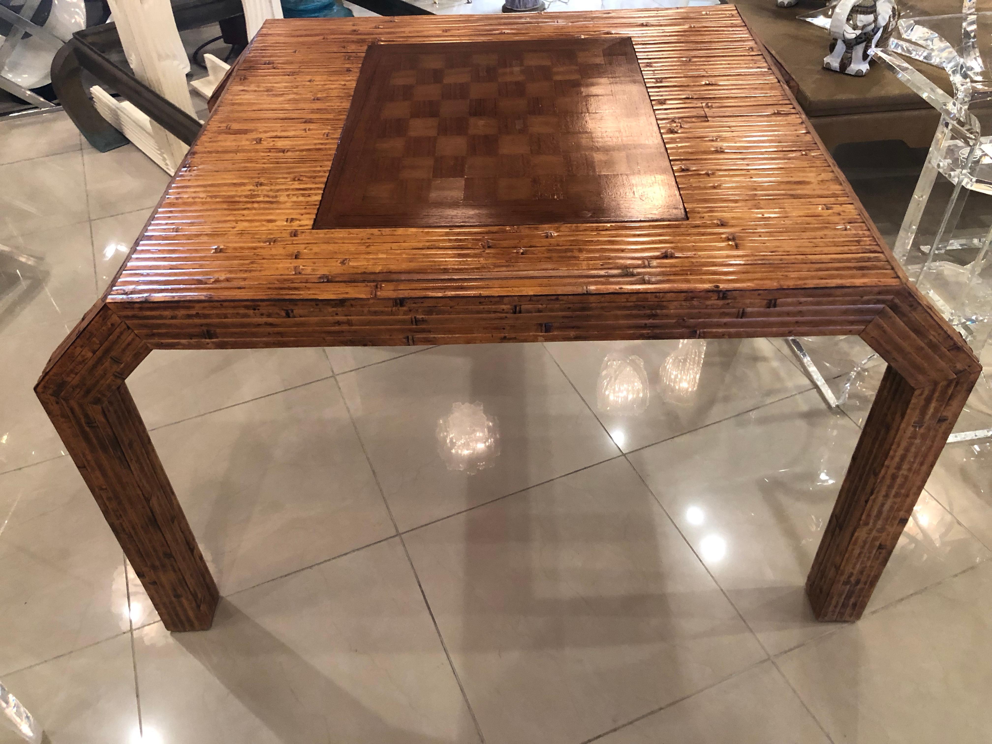 This is such an amazing game table! Lovely bamboo reed flat pieces, incredible flare and detail to the legs give this a fresh modern look. The game board piece can actually flip over so that the table can be used for dining and an everyday look