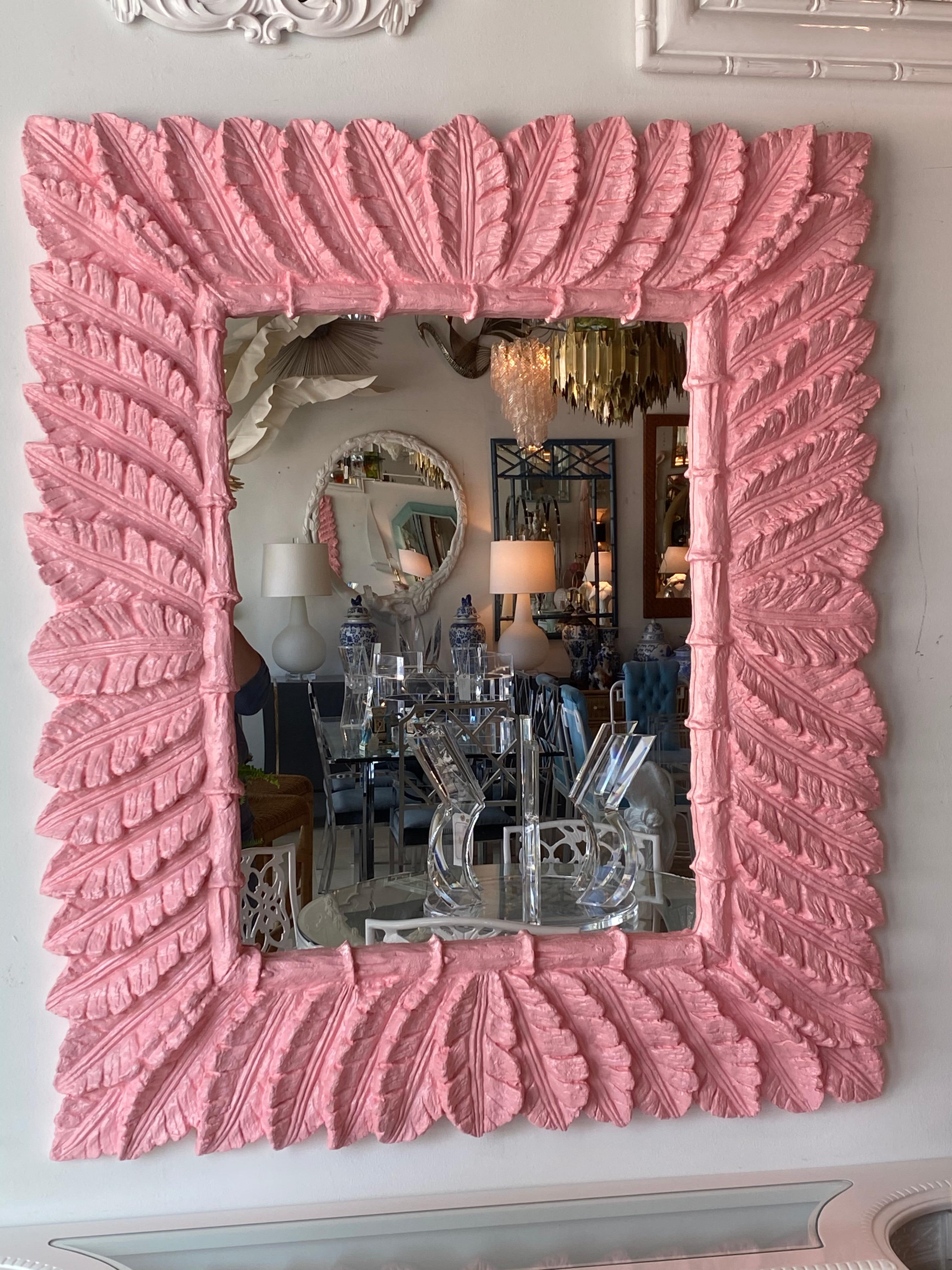 Lovely vintage wall mirror lacquered in a pretty coral pink. Comes ready to hang. No chips or breaks.