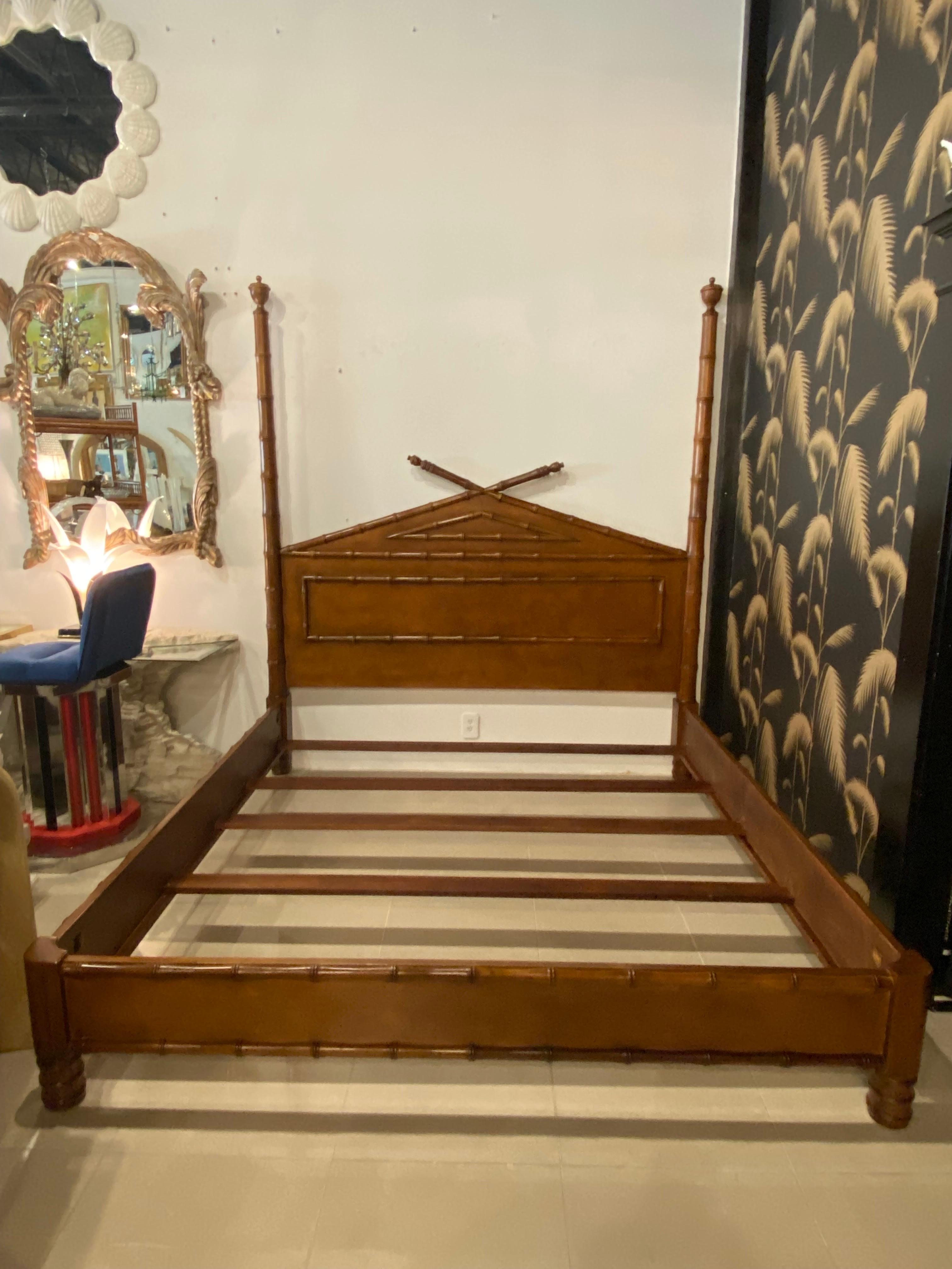 Vintage faux bamboo Chinese Chippendale wood king size bed. This includes headboard, 2 side rails, footboard and wood slats for mattress. Original wood finish that may have minor imperfections. The posts on the headboard do unscrew for shipping and