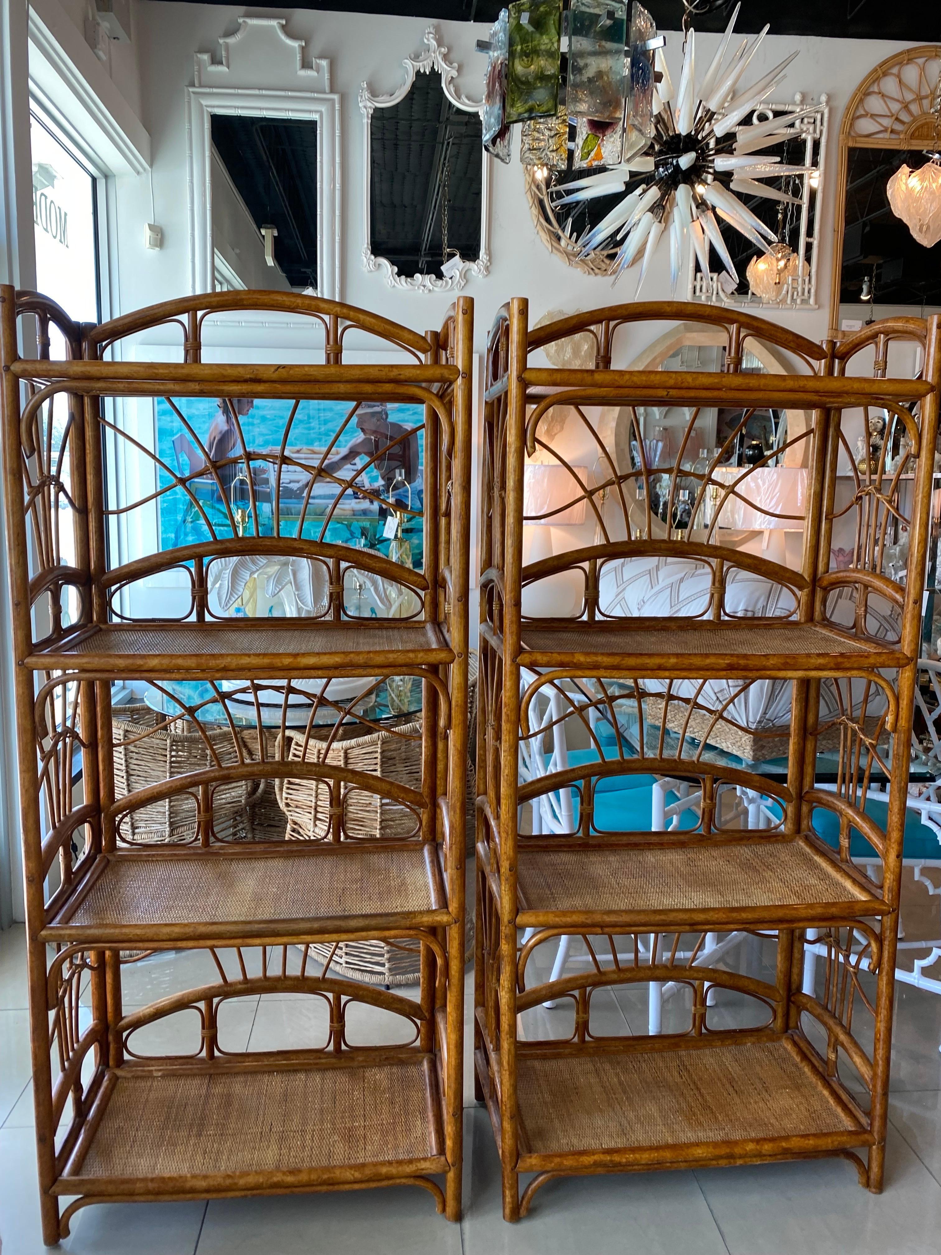 Vintage pair of rattan etageres with woven cane shelves. Original finish. Please let me know if you need an additional shipping quote. Dimensions are 72 H x 32 W x 16 D.
