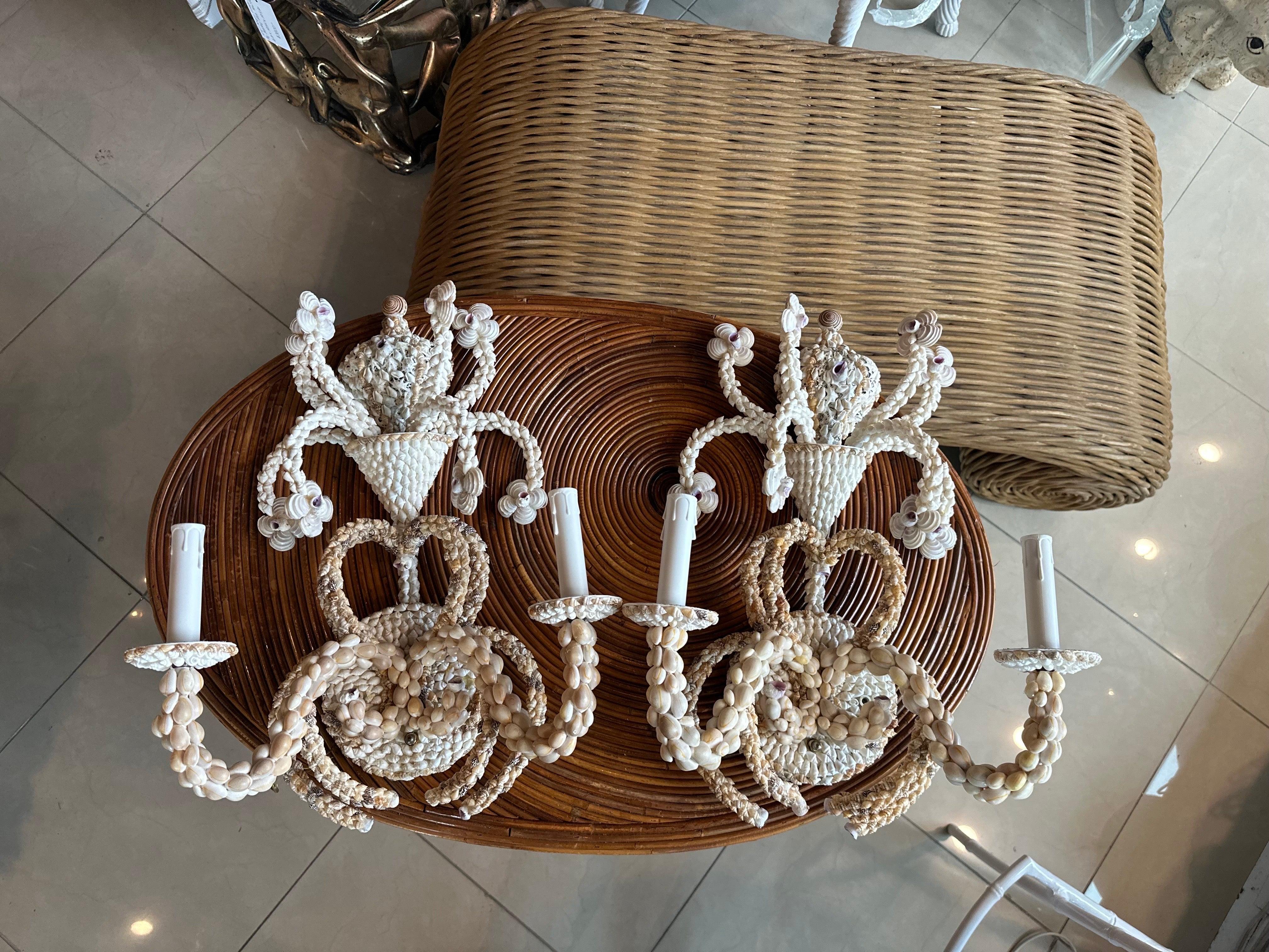 Vintage pair of seashell shell encrusted wall light lamp sconces. New candelabra covers. No damage or missing shells. Matching chandeliers also available. Dimensions 20 H x 15 W x 7.5 D. 