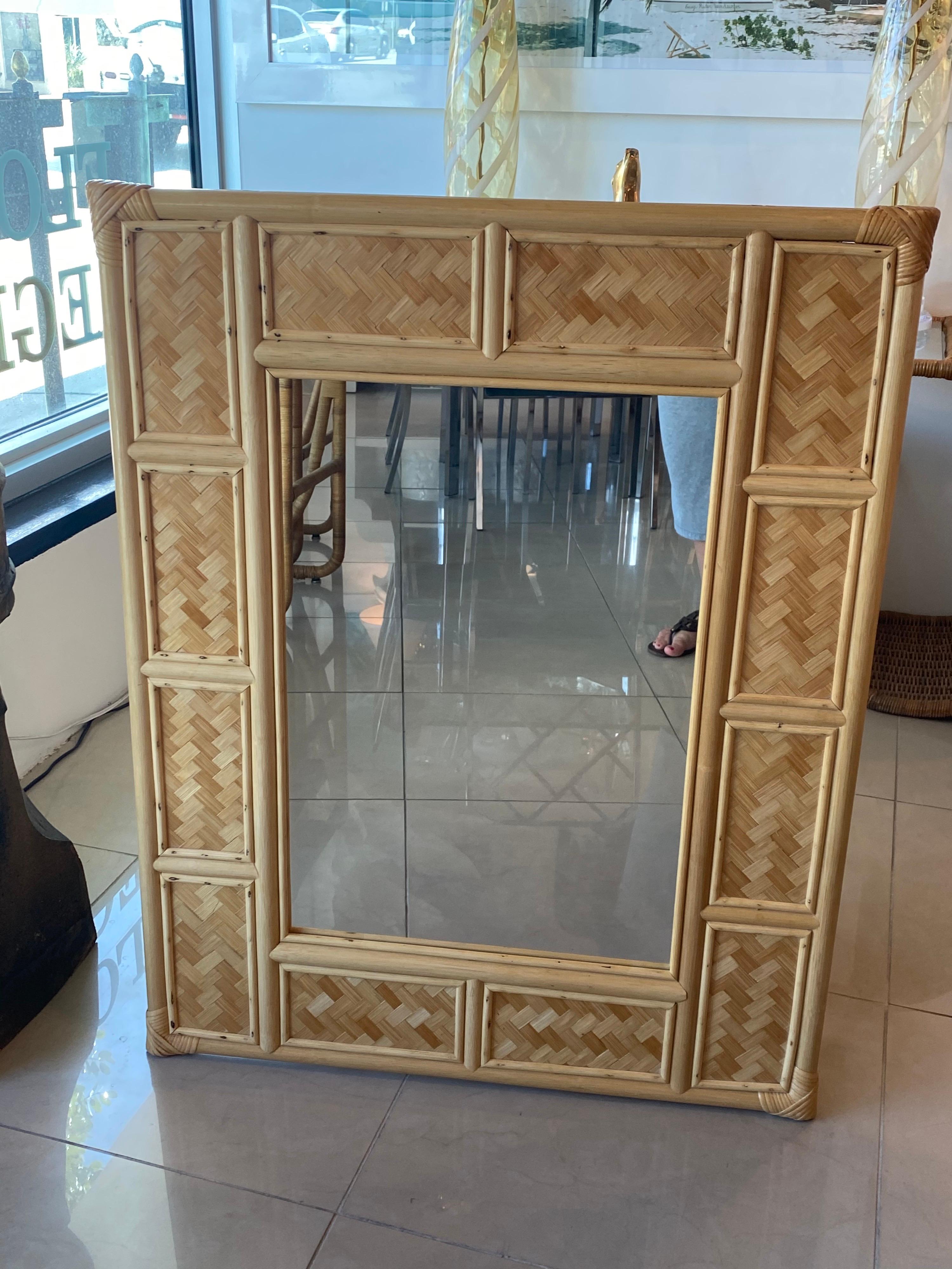Lovely vintage woven rattan wall mirror. No imperfections. Comes ready to hang on your wall.