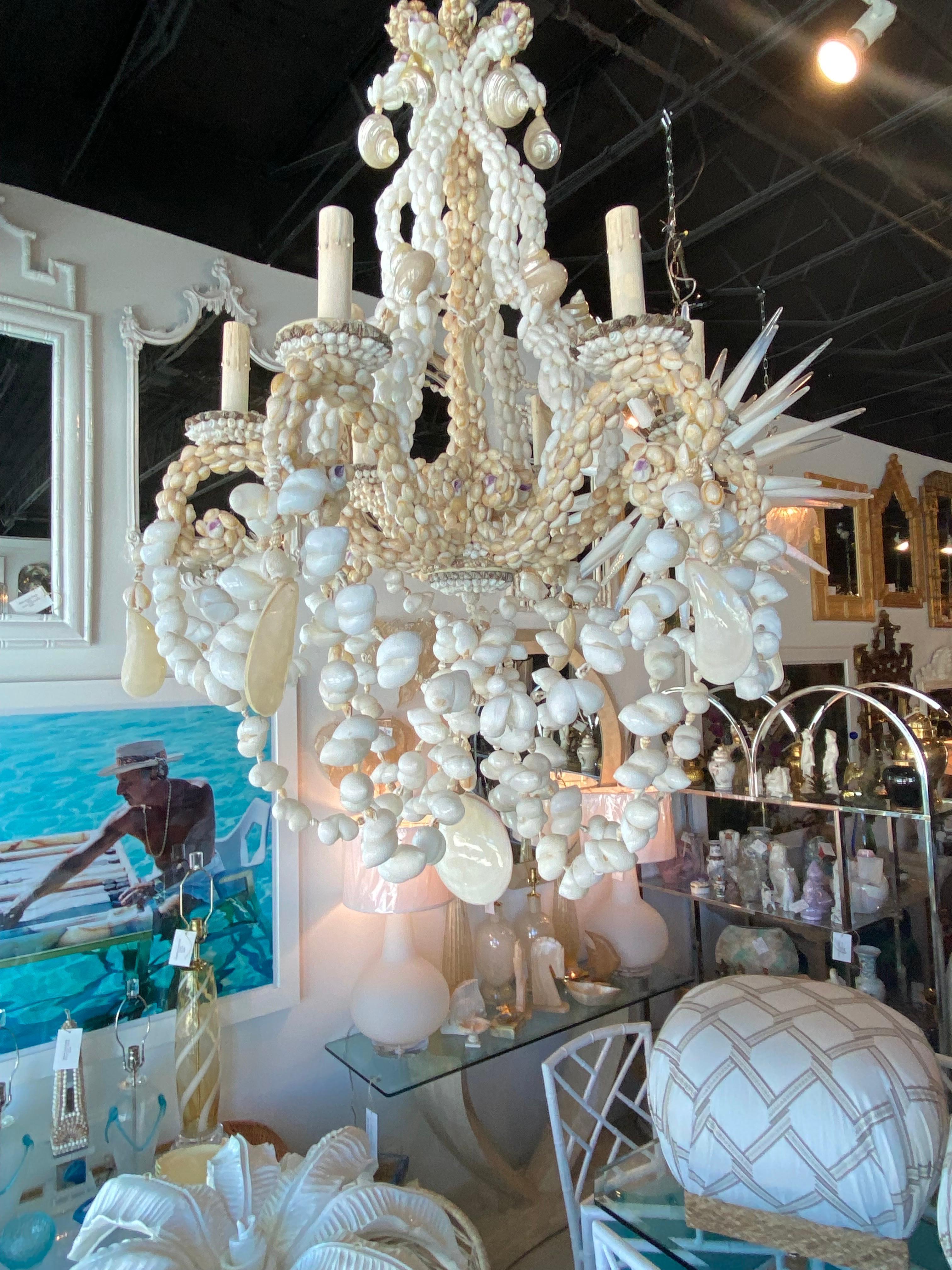 Beautiful vintage seashell shell 6 light chandelier. No missing or broken shells. Comes with original ceiling cap. Size is 34 H x 24 D, chandelier only, size does not include the chain on it.