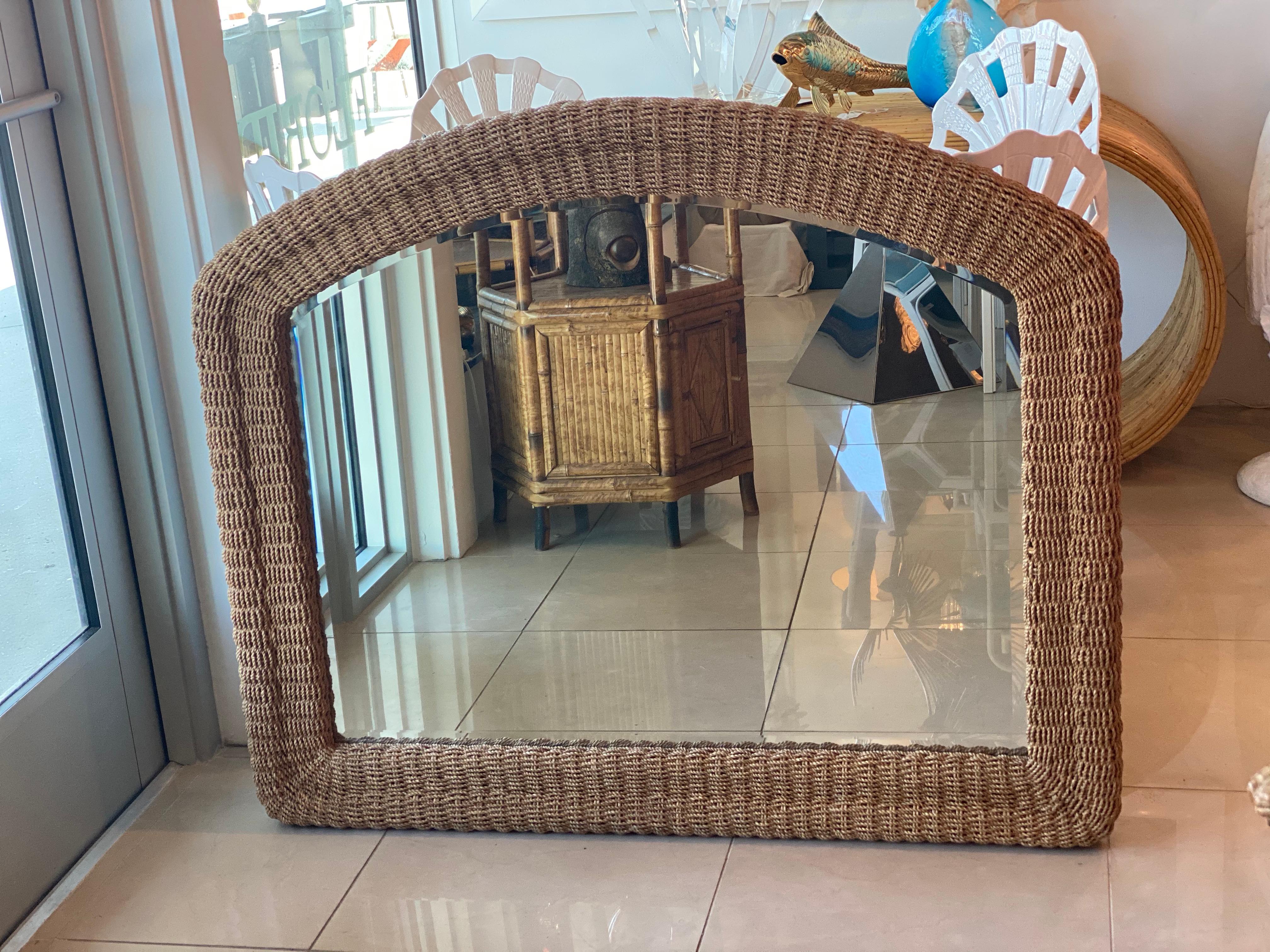 Beautiful vintage arched wall mirror. Comes ready to hang on your wall. Braided seagrass rope weaved in wicker.