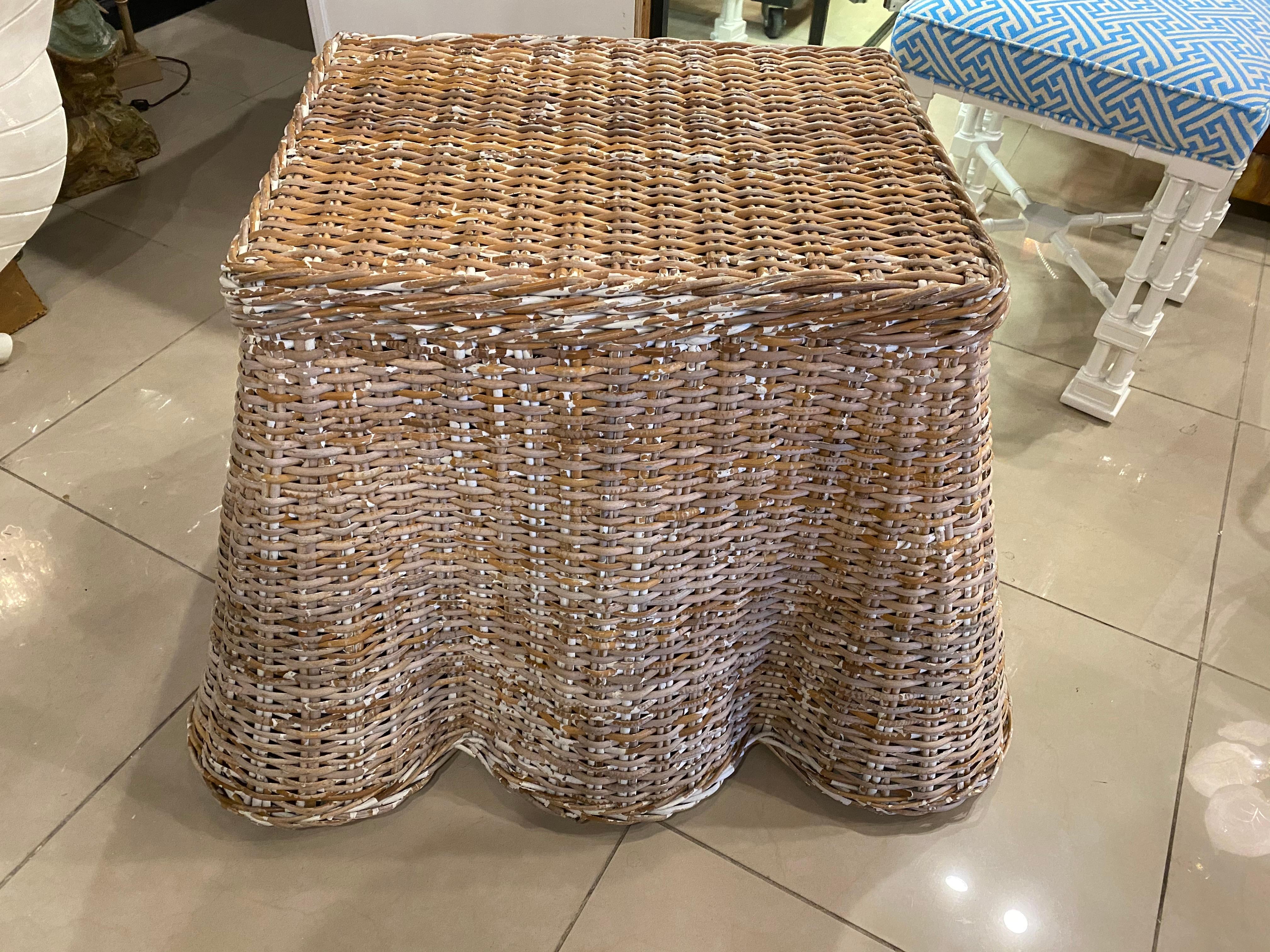 Lovely vintage draped wicker coffee cocktail table, end or side table. Very sturdy and well built. Original vintage wicker finish with some old chippy white paint that gives it a great aged, farmhouse look. No broken or missing wicker pieces.
Top