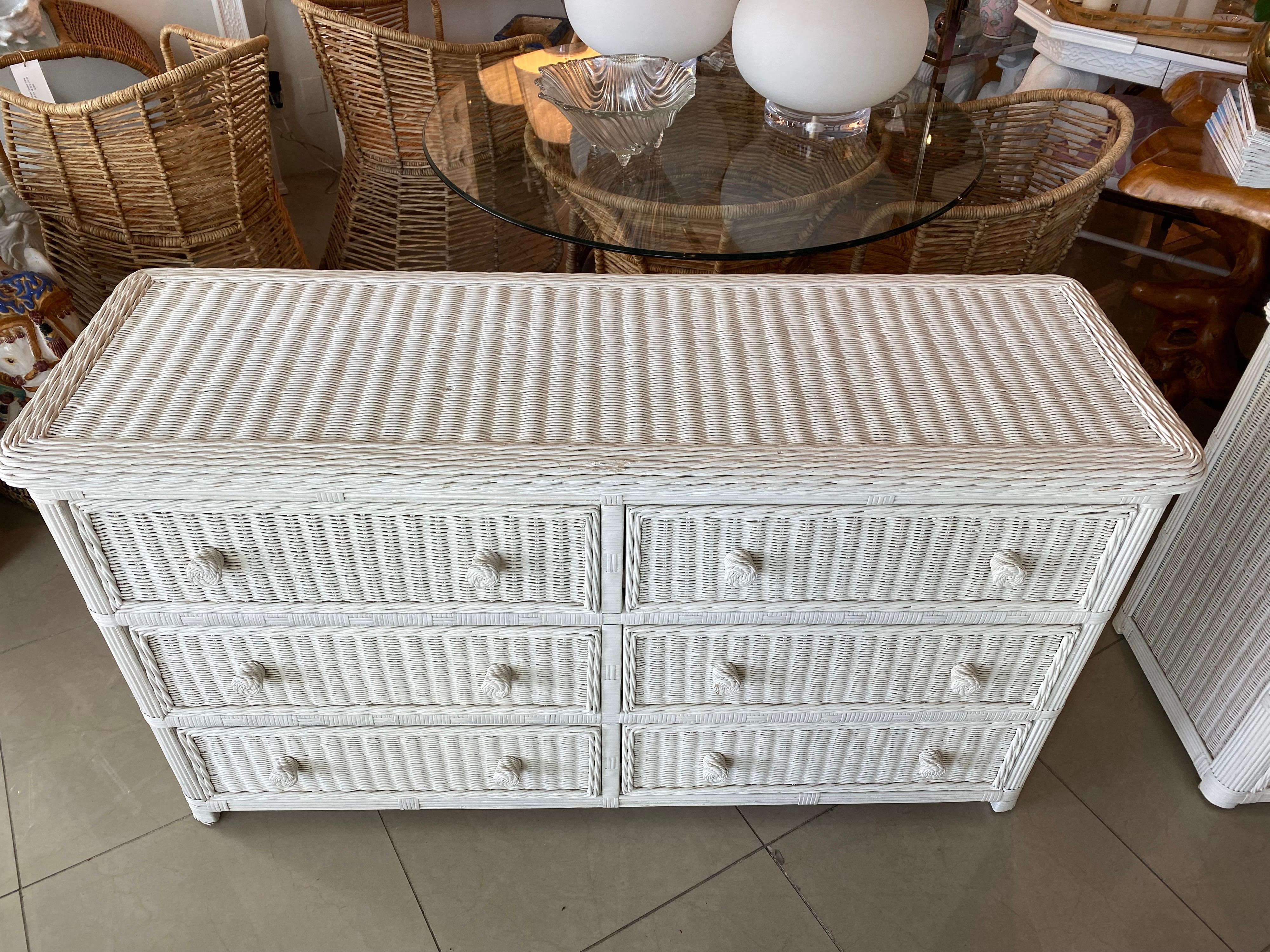 Vintage white wicker dresser with 6 drawers. Wicker is also on both sides and top. White finish is original and may have slight wear. Glass top is also included for the top of dresser. I have another of these listed if a pair is needed.