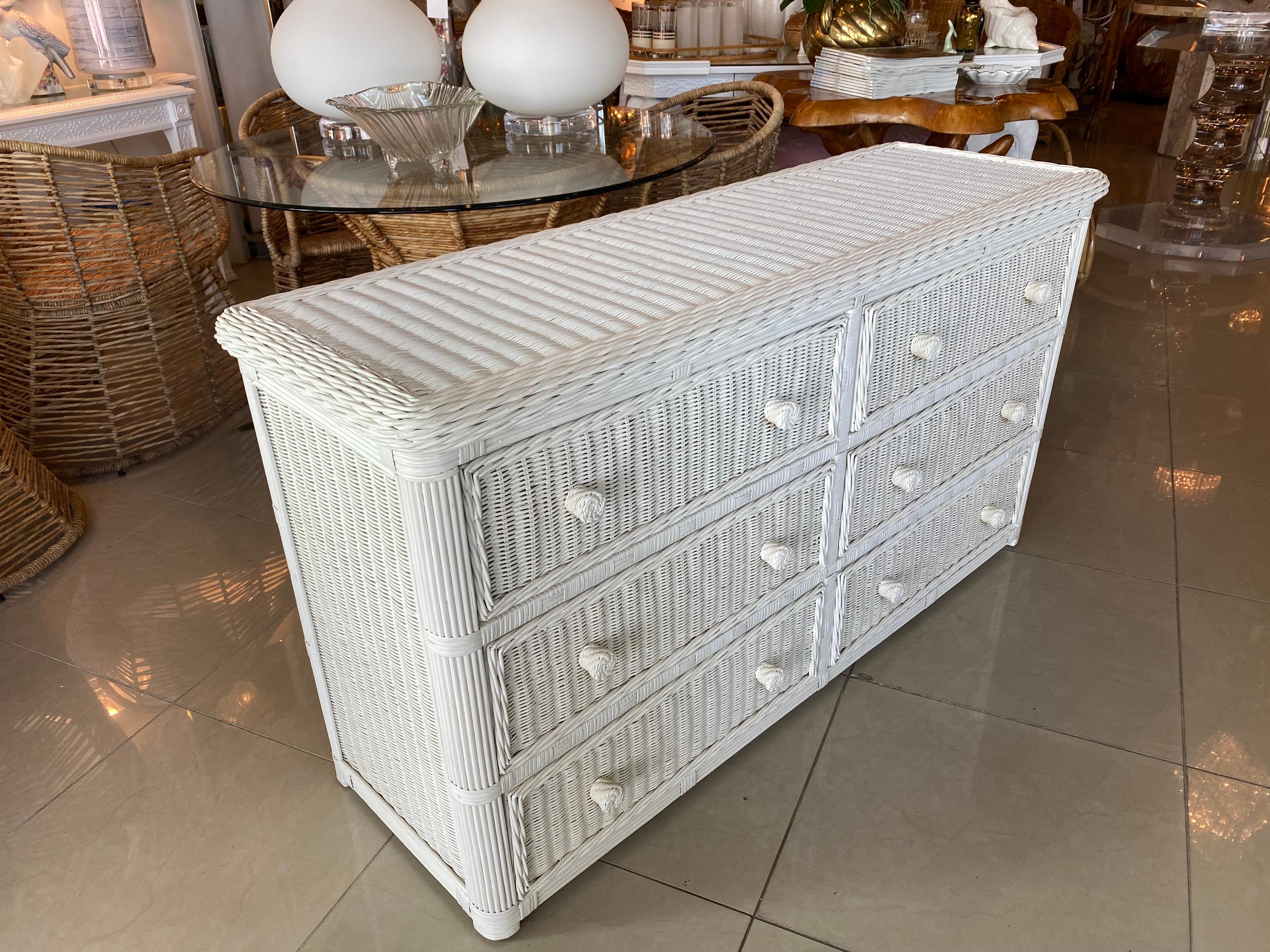 Vintage white wicker dresser with 6 drawers. Wicker is also on both sides and top. White finish is original and may have slight wear. Glass top is also included for the top of dresser.
Dimensions: 54 L x 18 D x 29 H.
