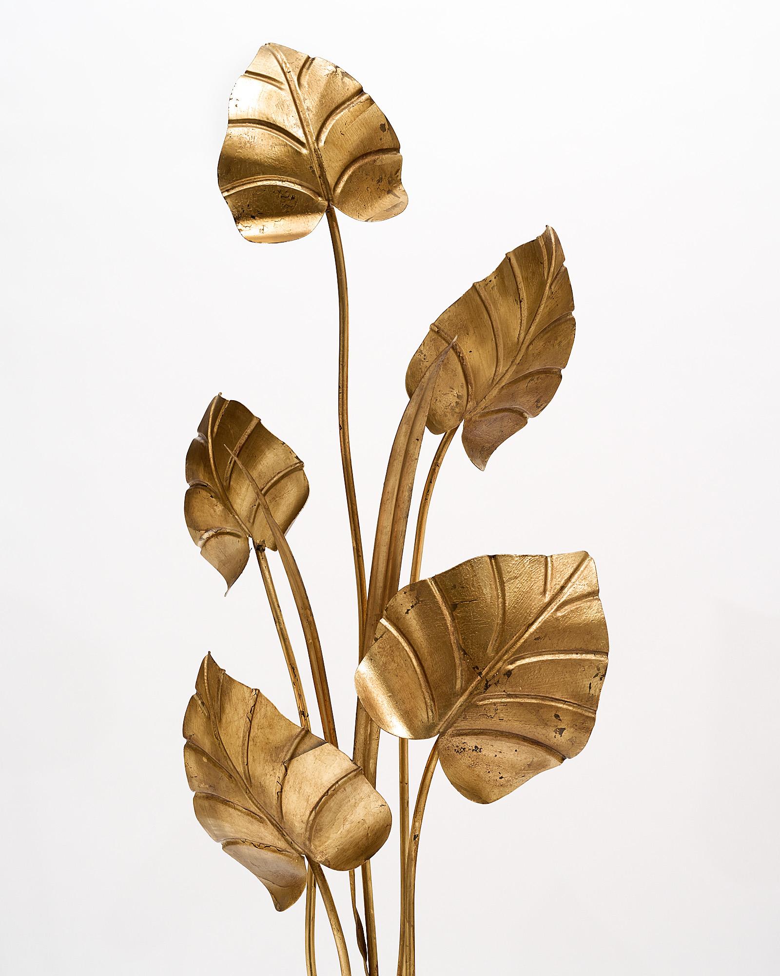 Floor lamp, French, made of gold leafed and patinated tole and featuring exotic foliage. This light has been newly wired to fit US standards.