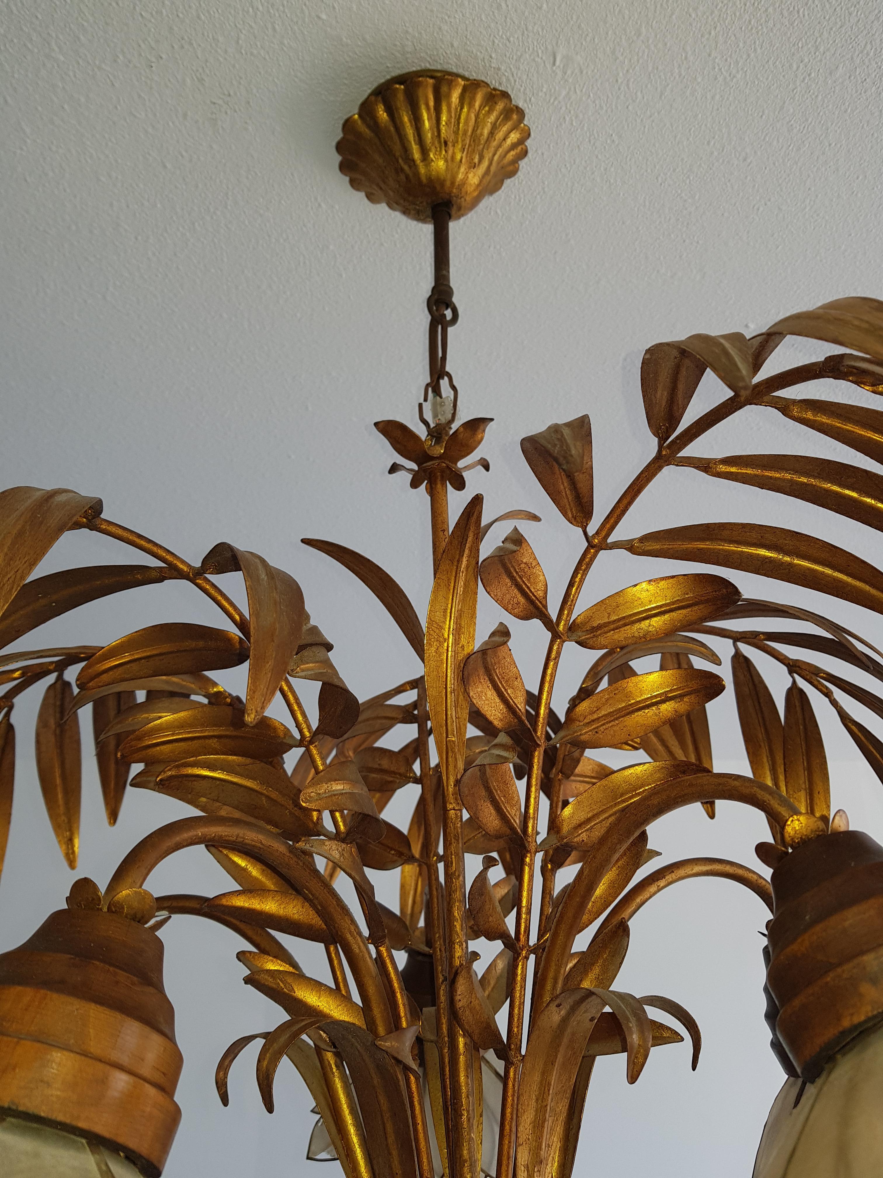 Vintage Palm leaf chandelier with mother of pearl blossom flowers, these are the bulb holders.
Designer could either be French or German as we see Hans Kogel has kind of items
Just stunning
This item comes with free bulbs, and free