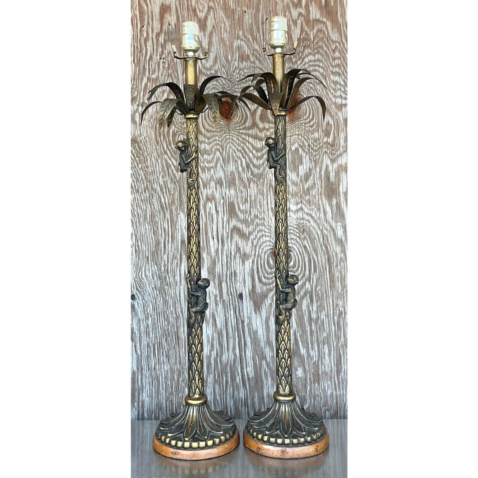 A gorgeous pair of vintage palm tree and monkey lamps that can add a touch of life to any coastal décor. Acquired at a Palm Beach estate.

The lamps are in great vintage condition. Minor scuffs and blemishes due to age and use.

The vendor has
