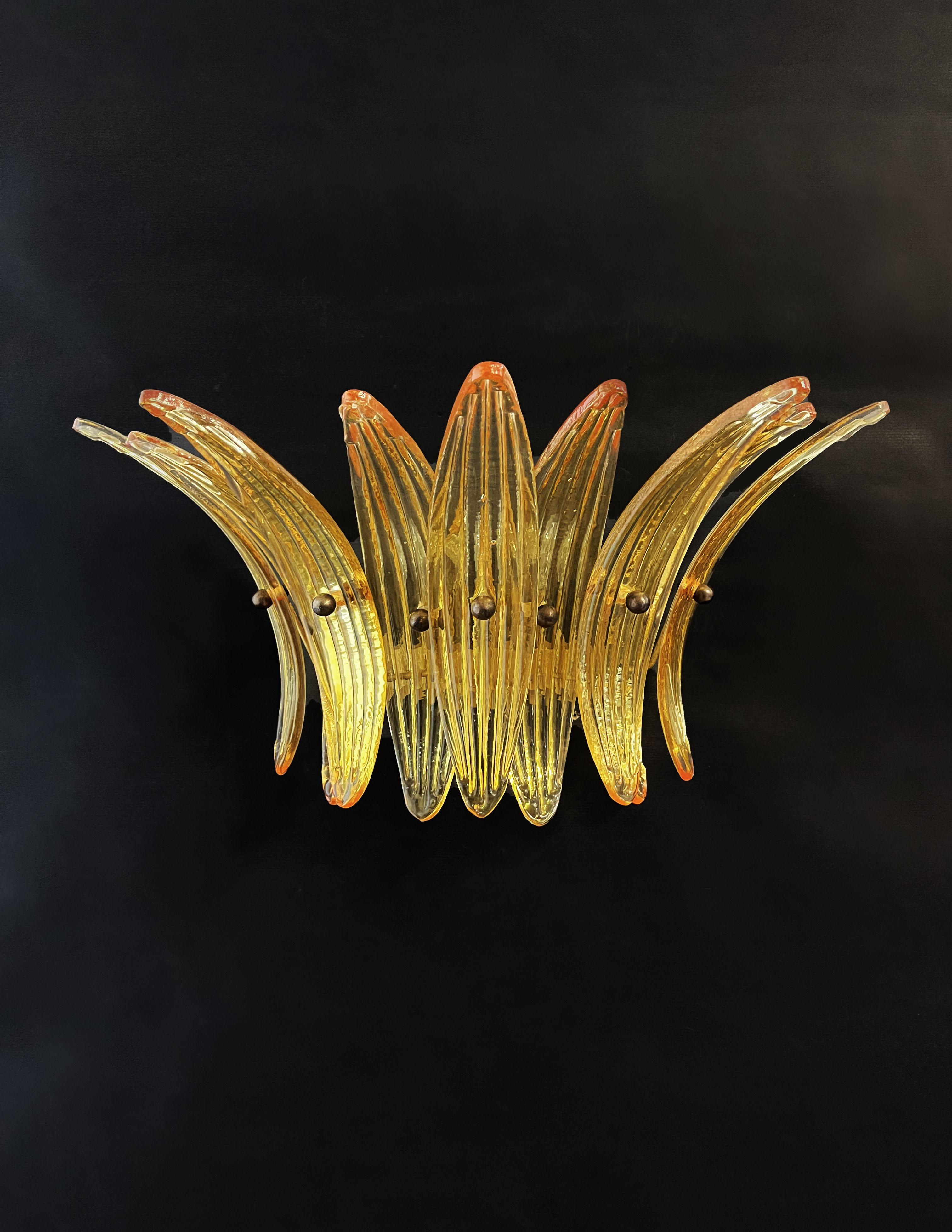 Luxury and GENUINE Murano glass pair of applique. 100% handmade IN MURANO. The appliques are made by 9 Murano handmade amber palmette glass, for each one, in a Solid metal frame gold painted and brass.
Period: late XX century
Dimensions: 9.80